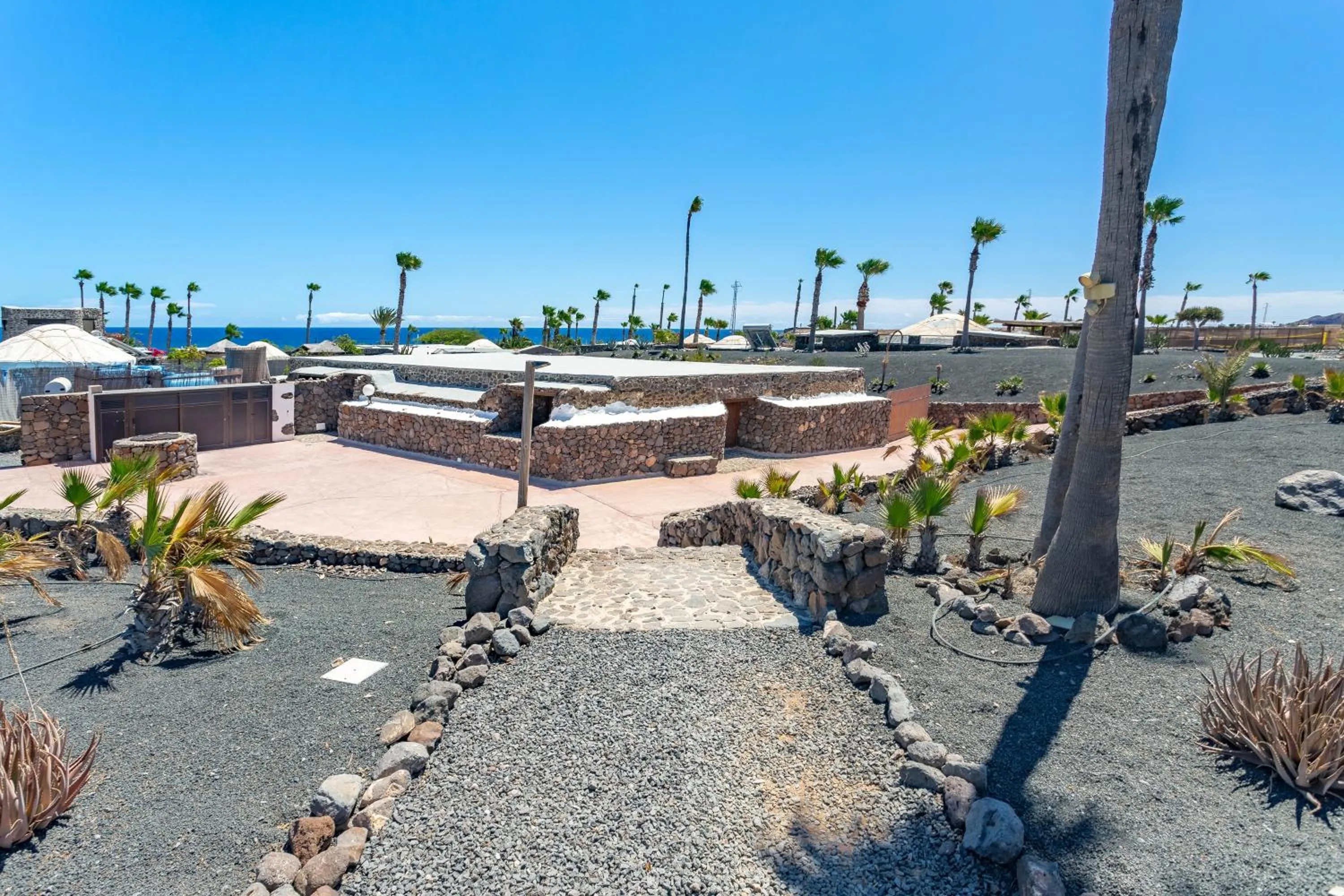 Property building in Finca De Arrieta Village - Yurts and Stone Cottages - Shared Pool - Walking distance to Arrieta Beach - Off Grid