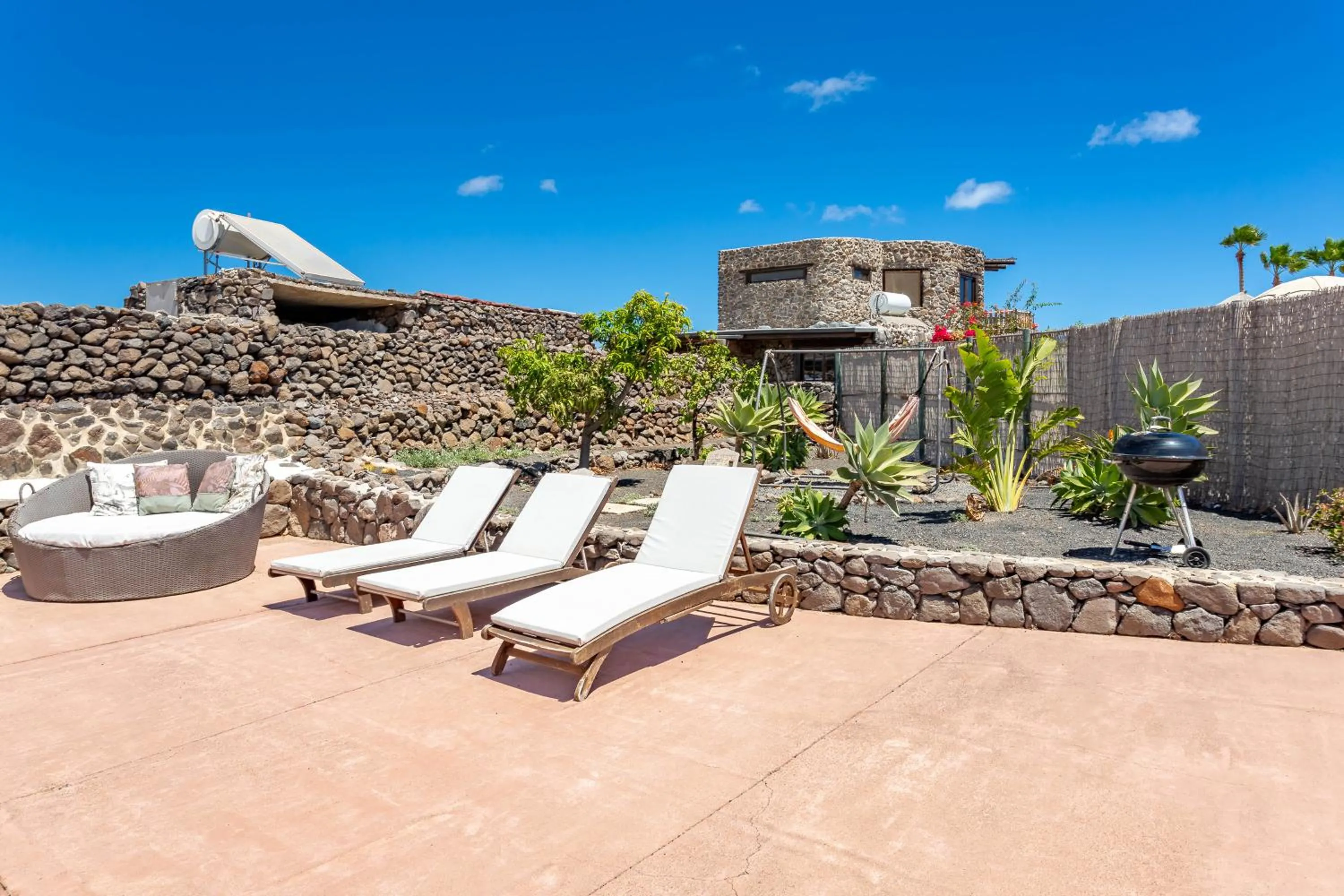 Garden in Finca De Arrieta Village - Yurts and Stone Cottages - Shared Pool - Walking distance to Arrieta Beach - Off Grid