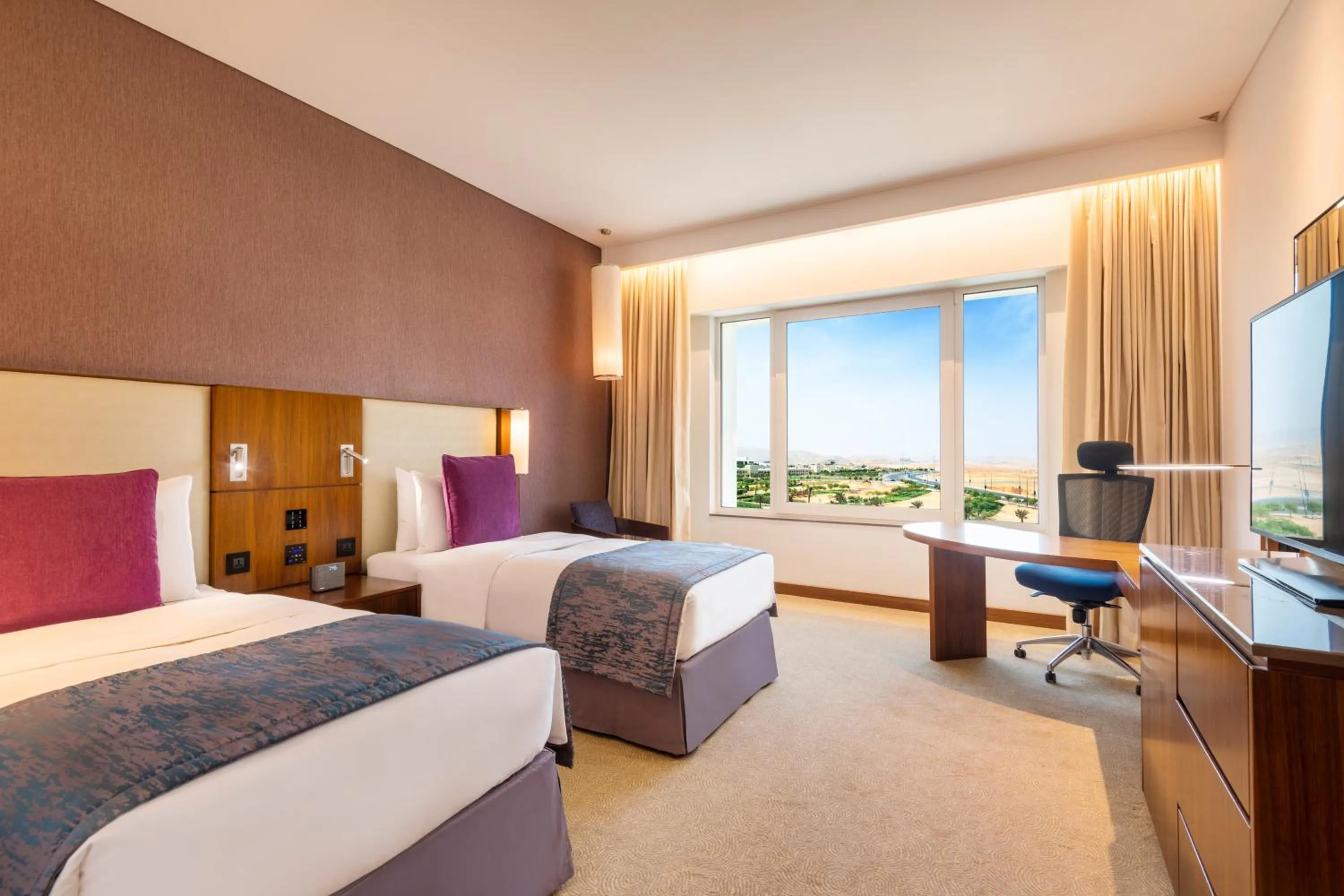 Bed in Crowne Plaza Muscat OCEC by IHG