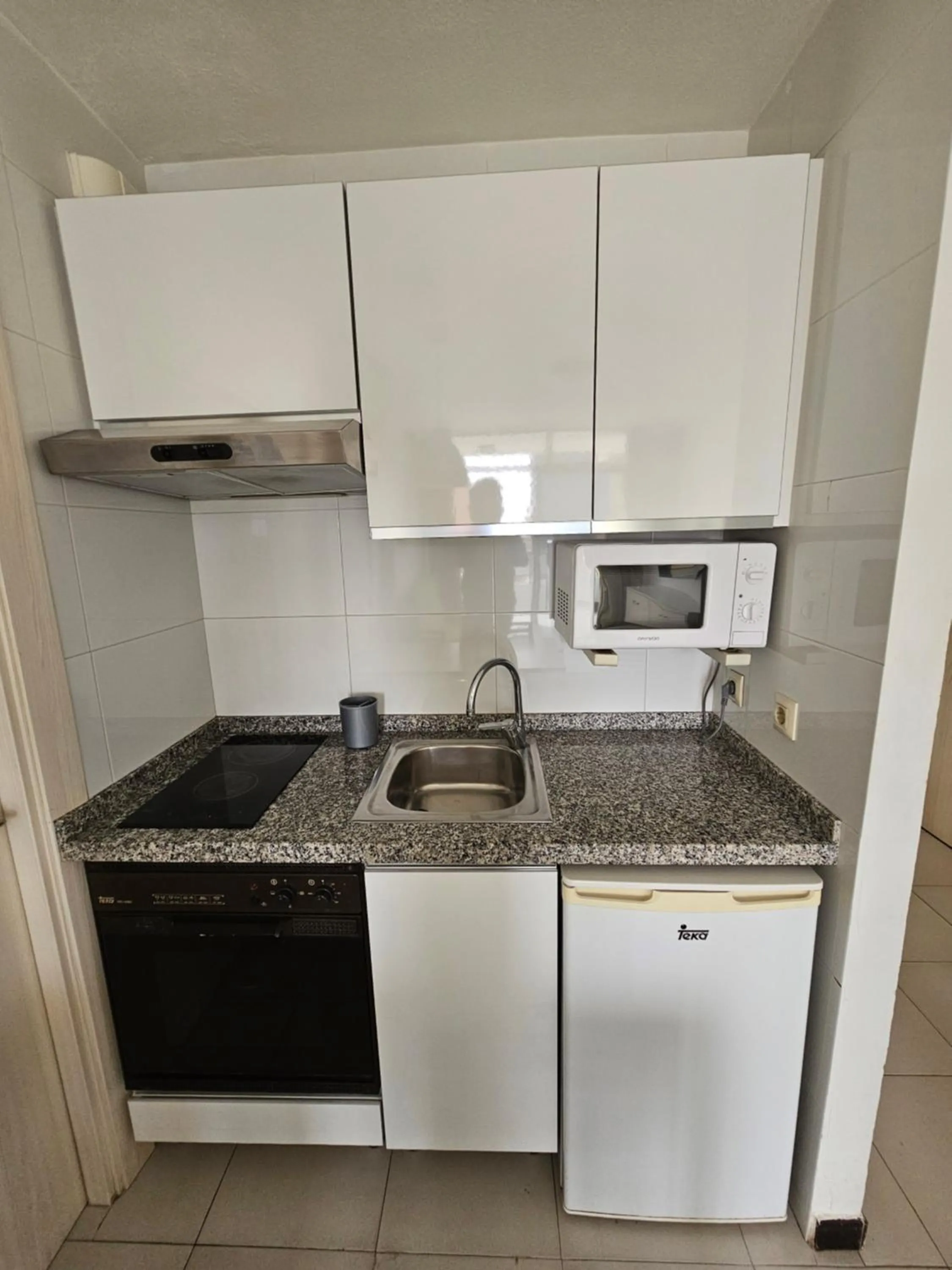 Kitchen or kitchenette in Apartamentos Maria Victoria