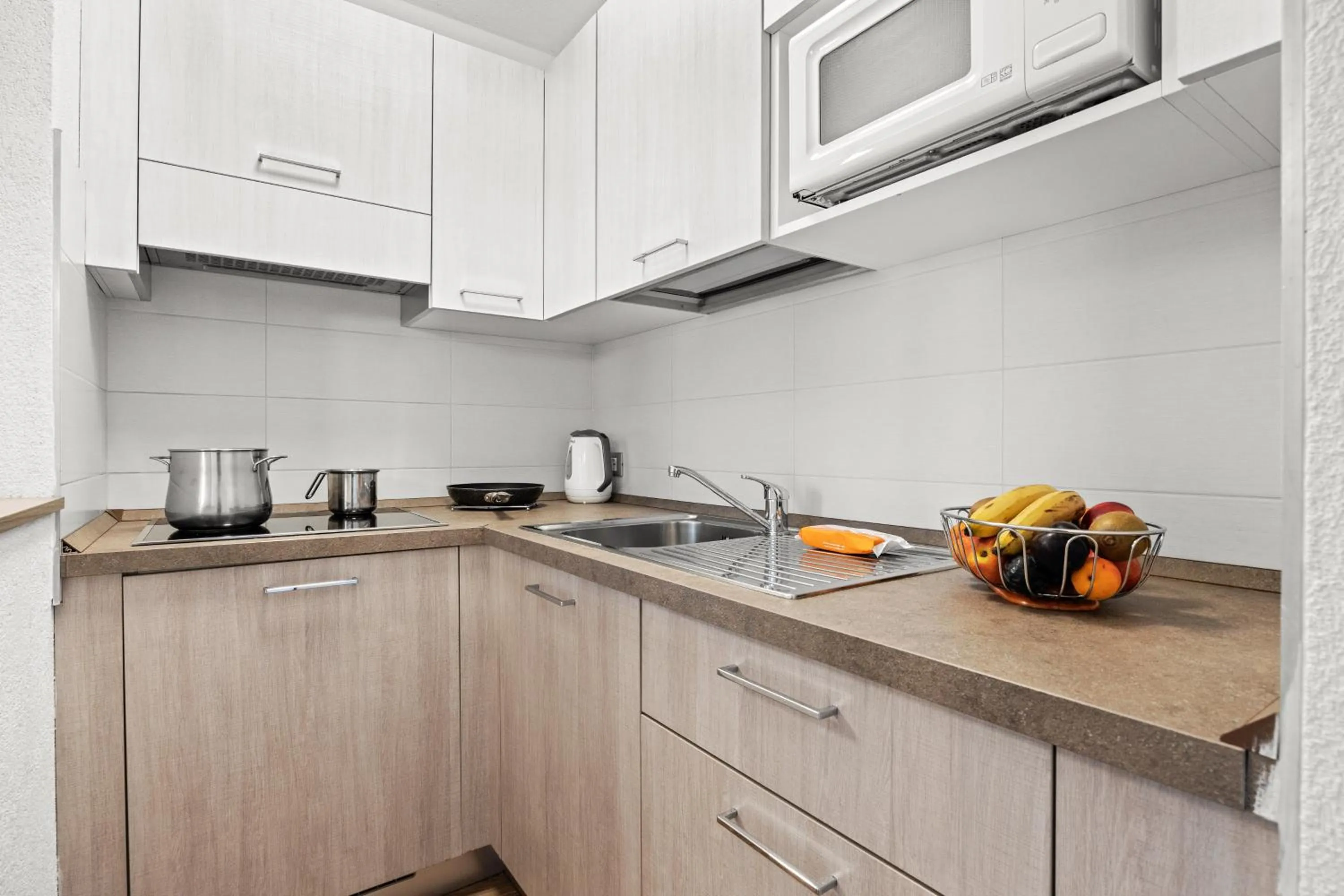 Kitchen or kitchenette in Aparthotel Des Alpes