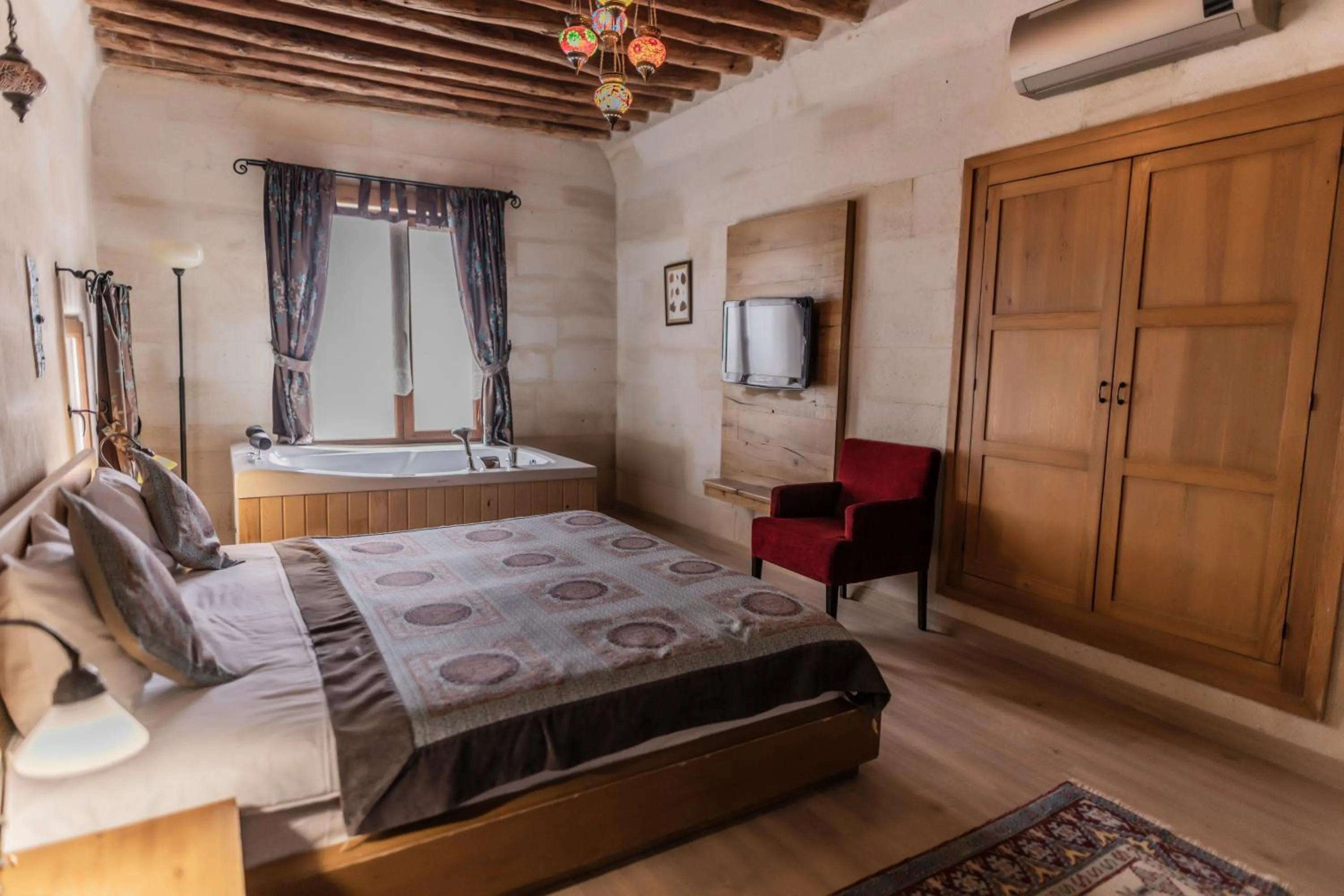 Bed in La Casa Cave Hotel