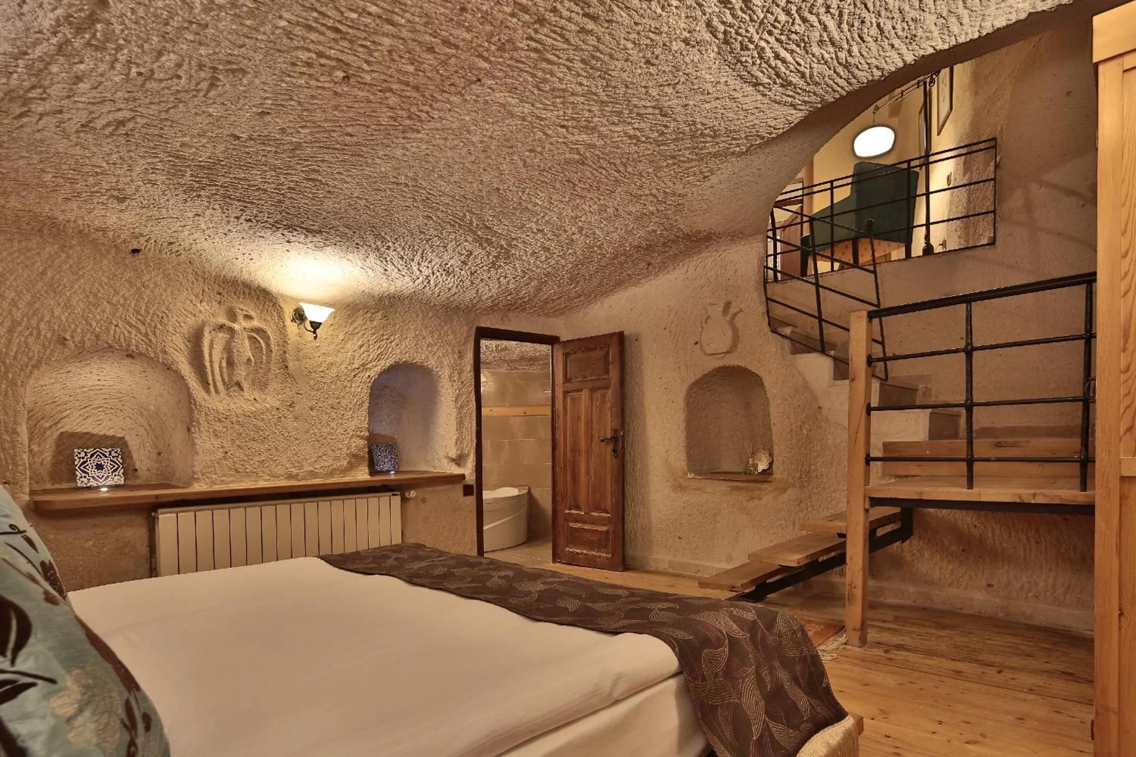 Bed in La Casa Cave Hotel