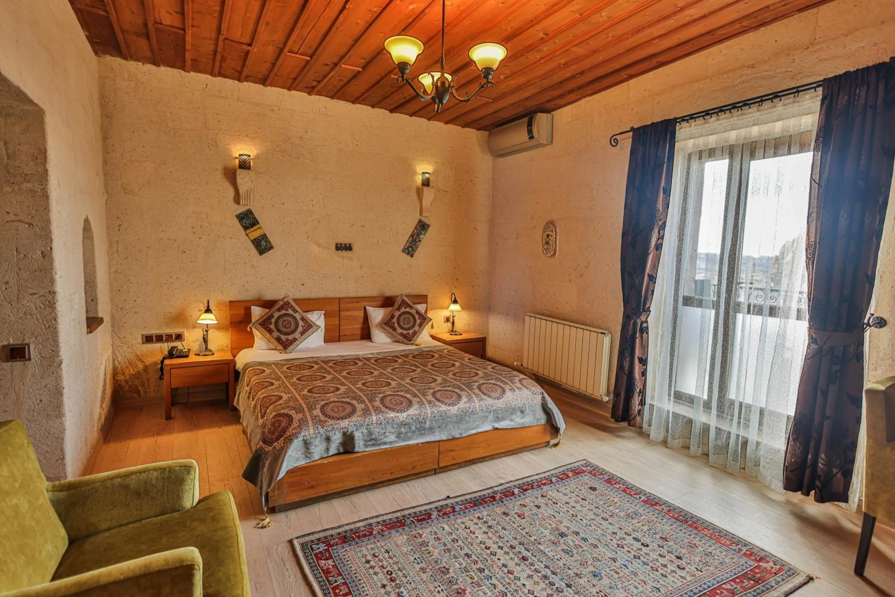 Bed in La Casa Cave Hotel