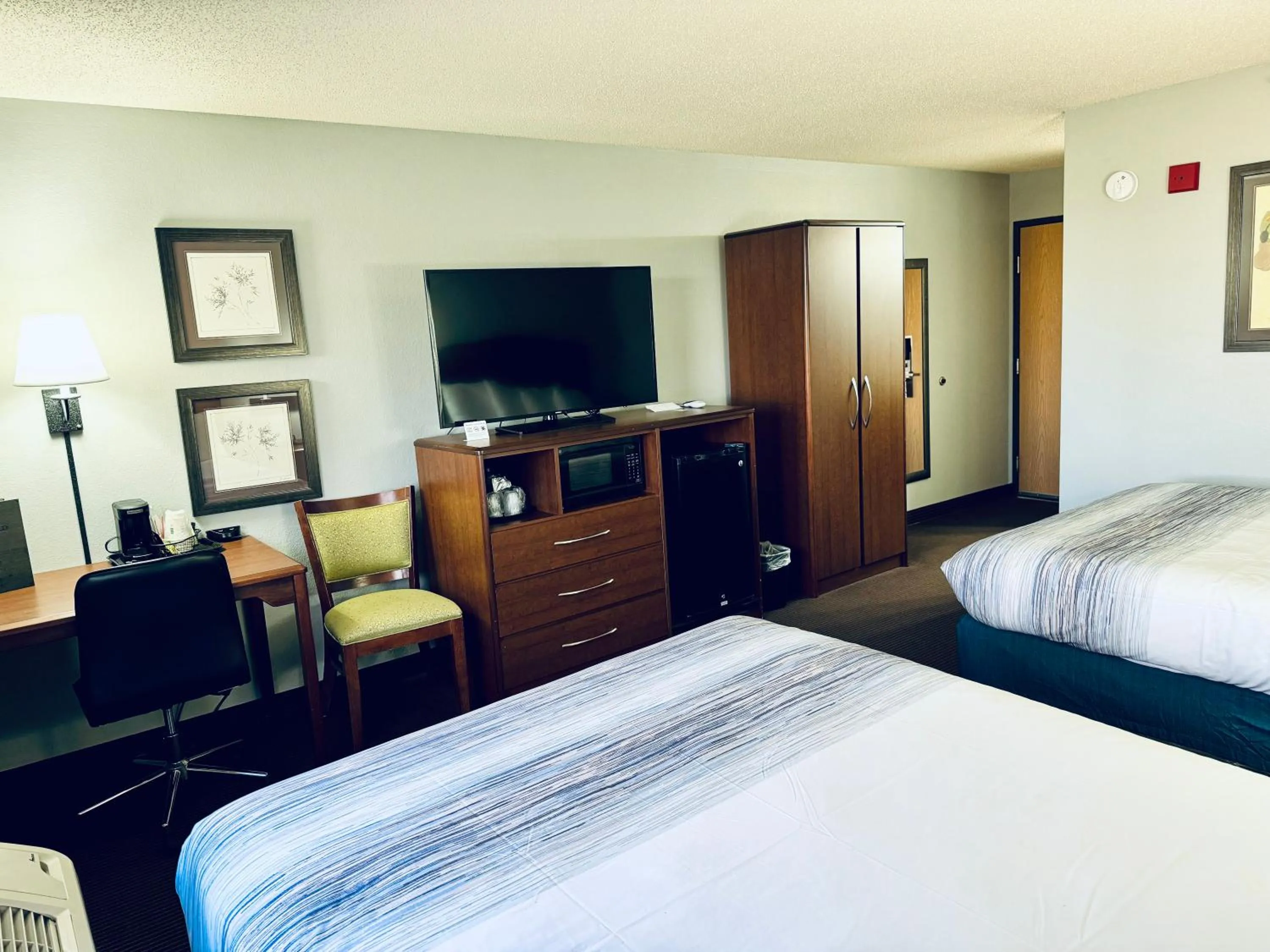 Bed in AmericInn by Wyndham Stillwater