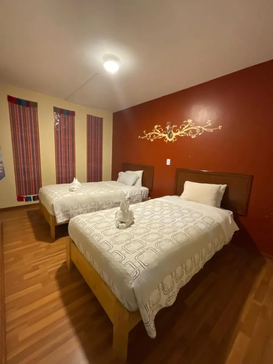 Bed in Hotel Andean Host Inn