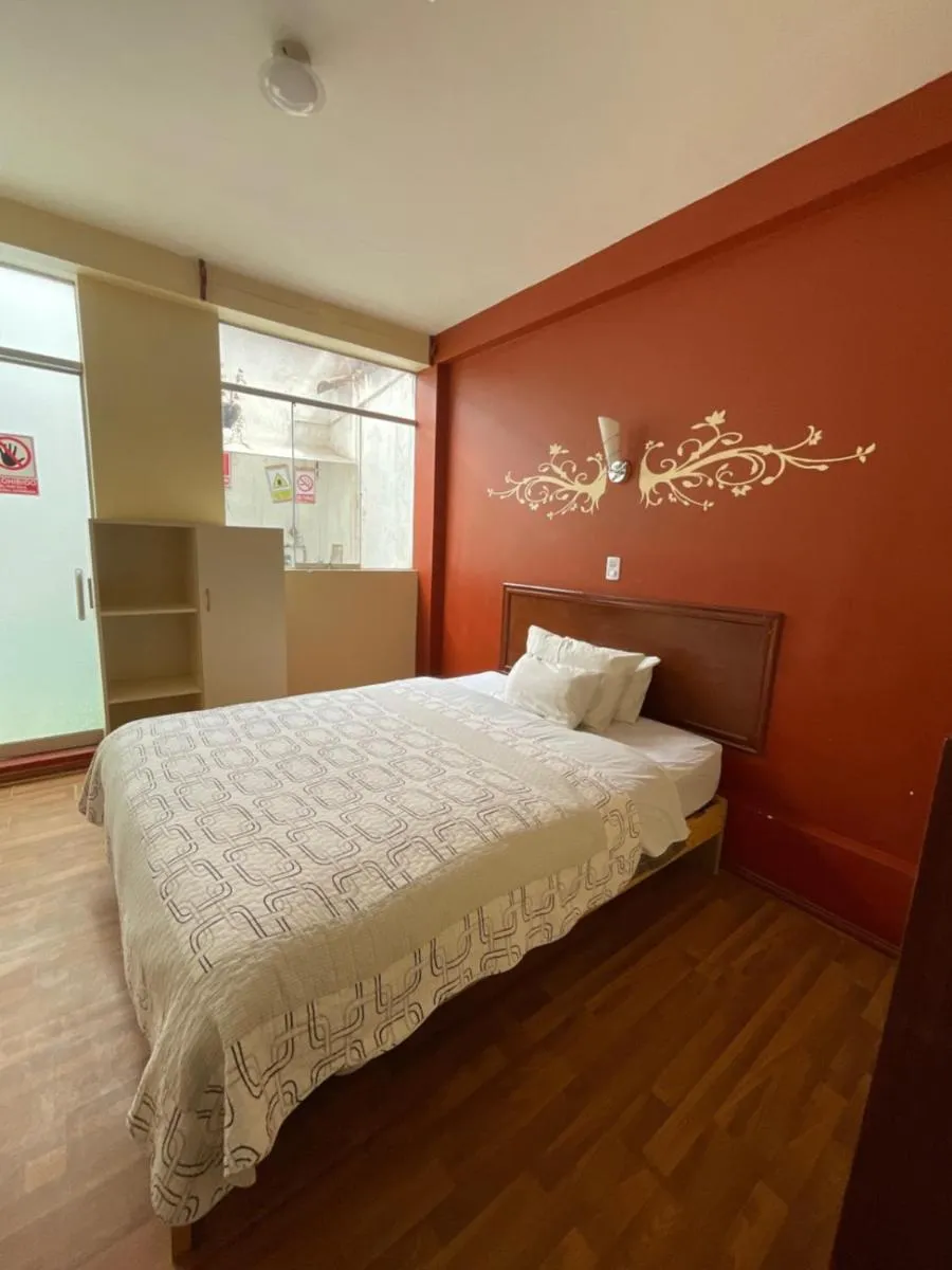 Bed in Hotel Andean Host Inn