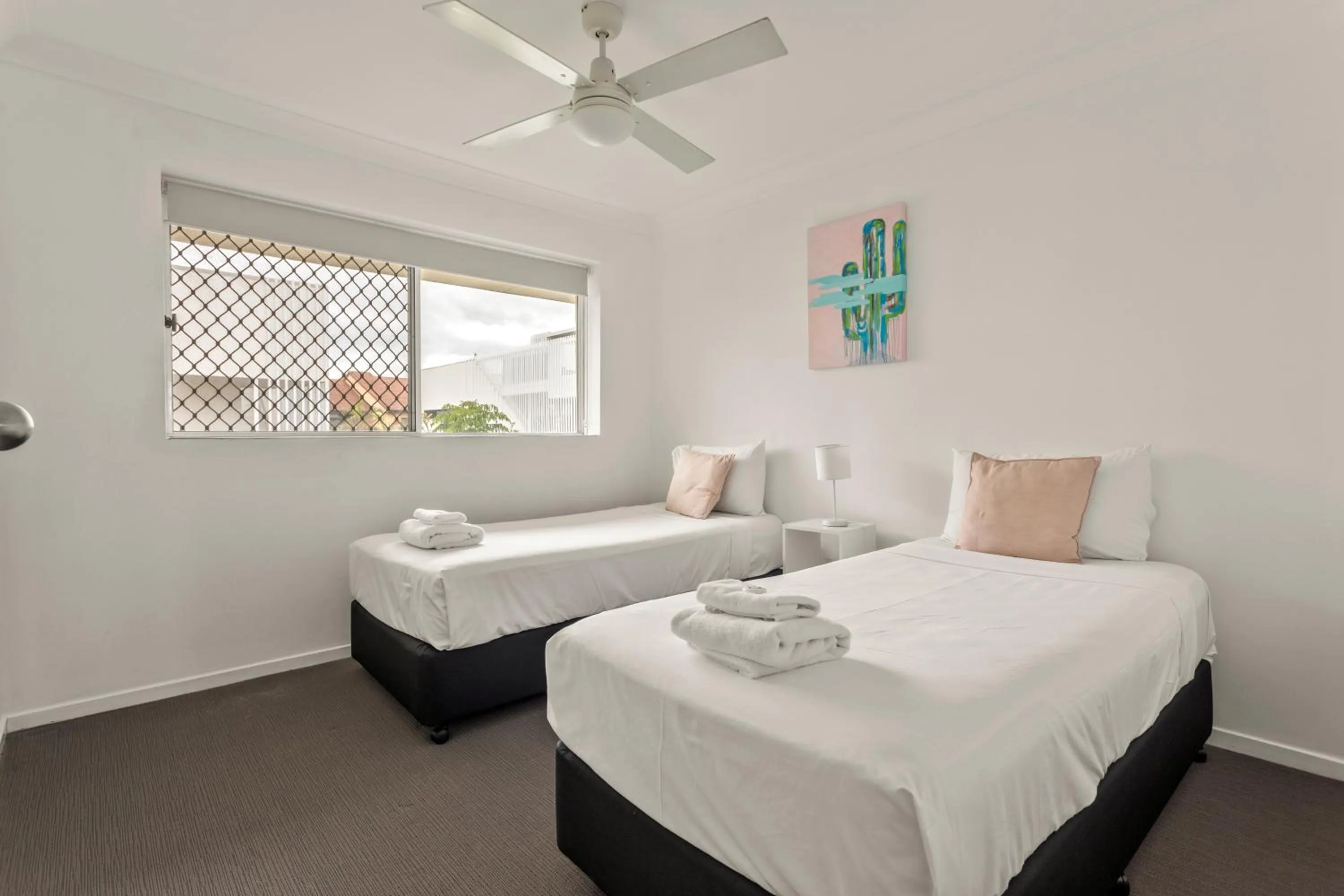 Bed in Kirra Palms Holiday Apartments