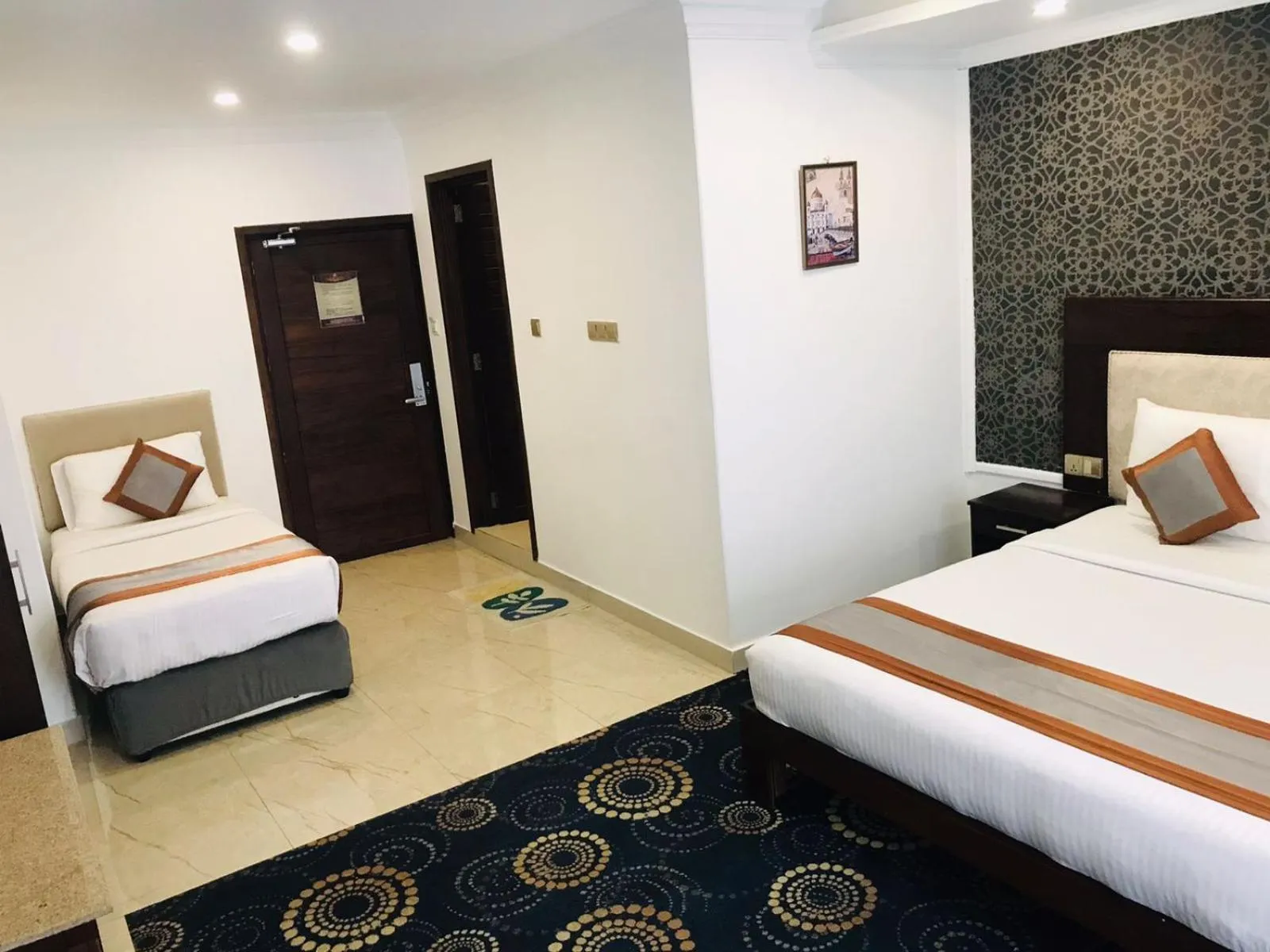 Bed in Galaxy Grand Hotel