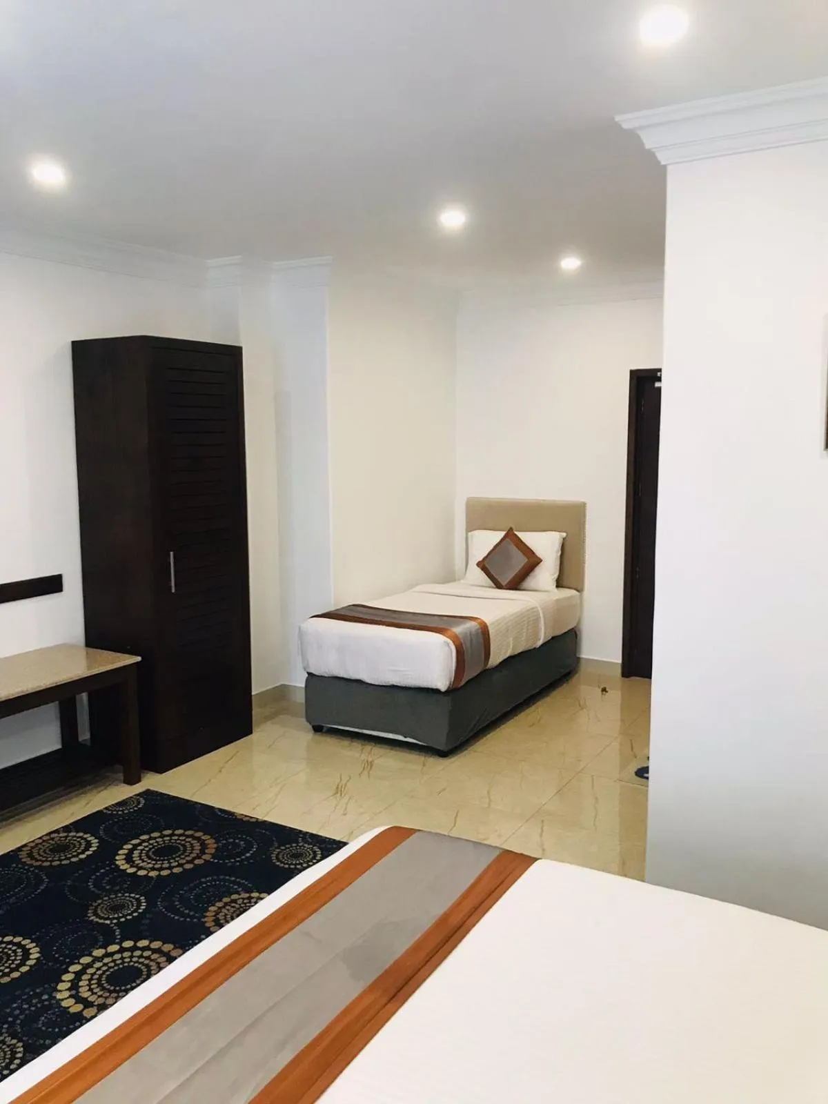 Bed in Galaxy Grand Hotel