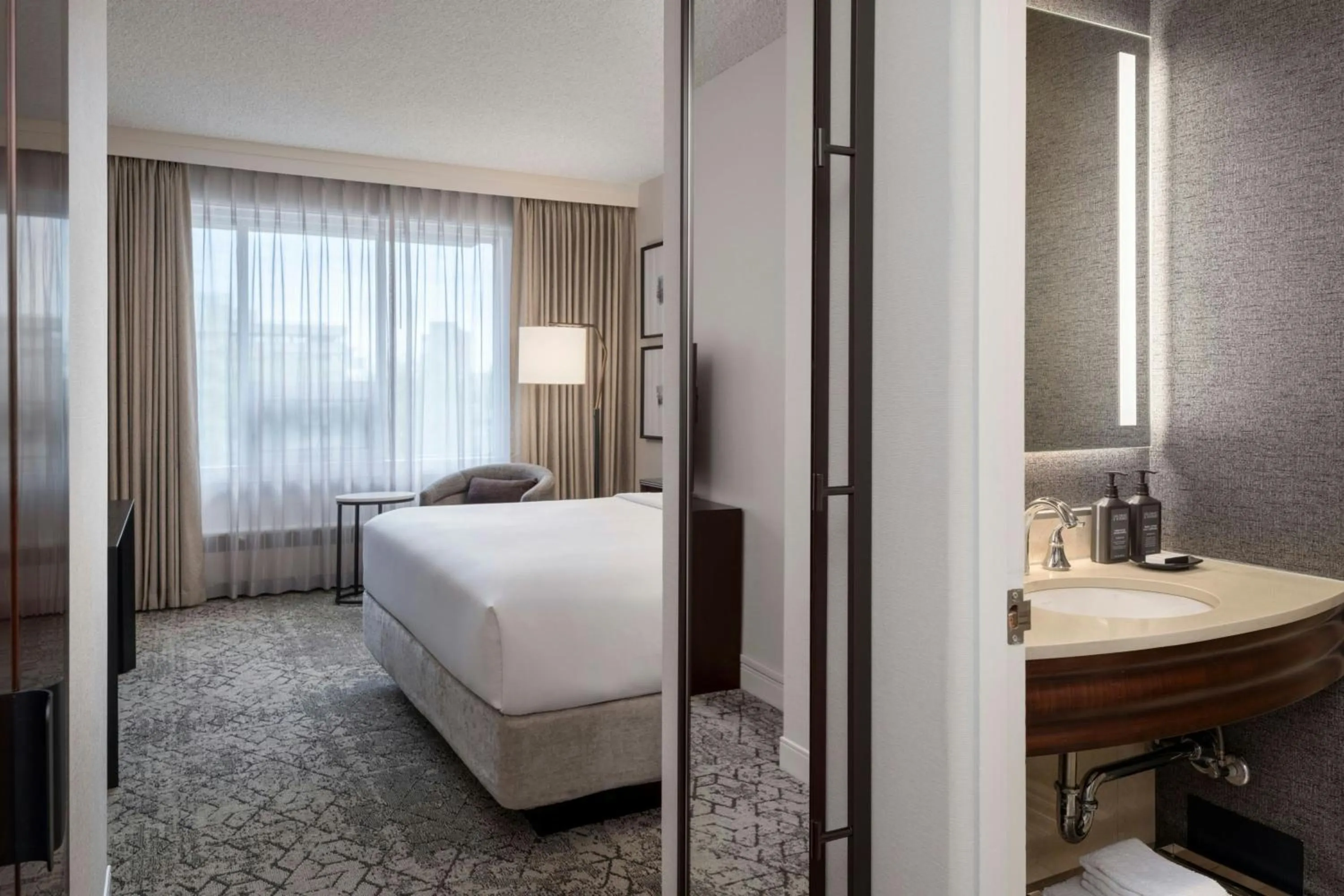Bathroom, Bed in Sheraton Cavalier Saskatoon Hotel