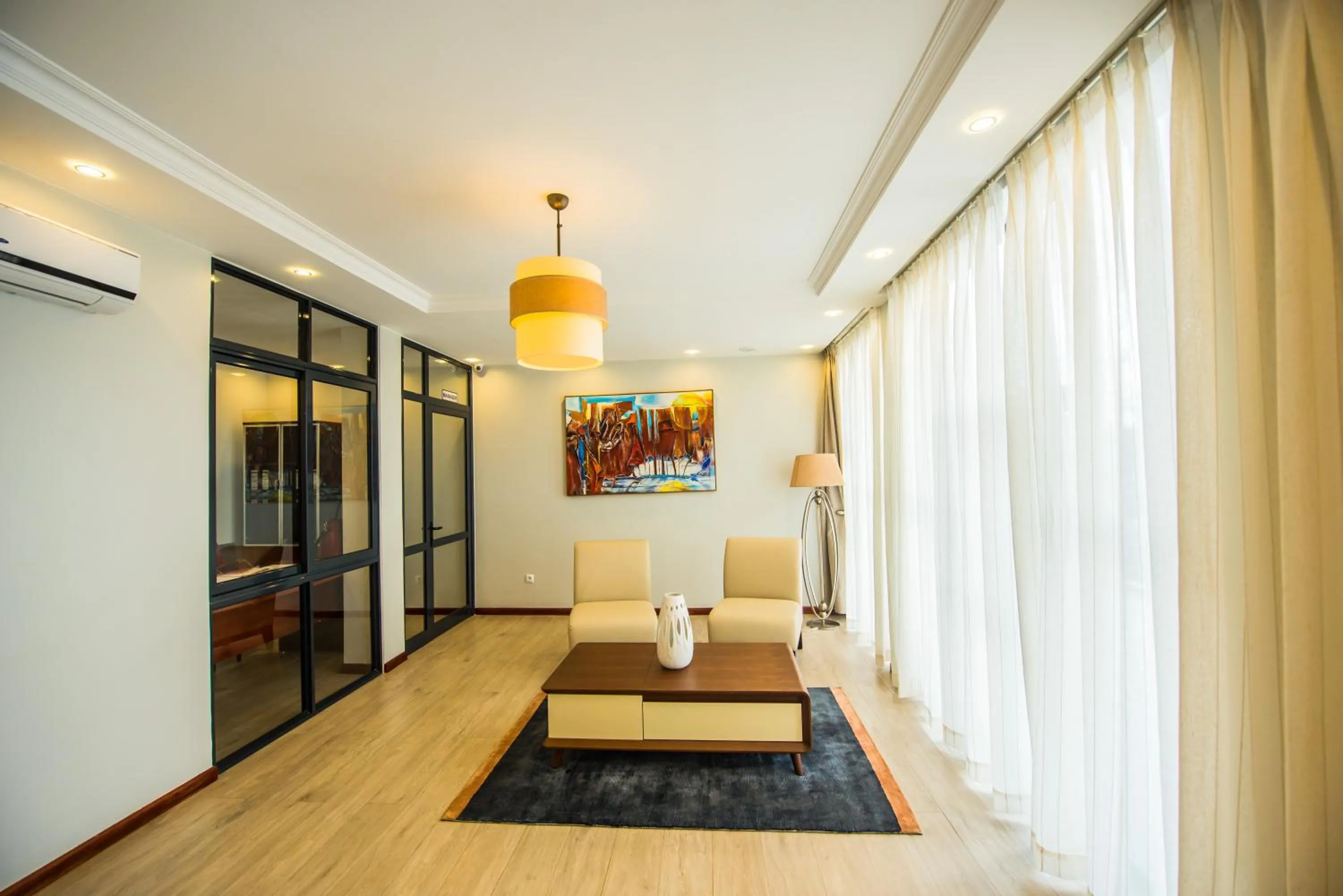 Communal lounge/ TV room in The Court Boutique Hotel