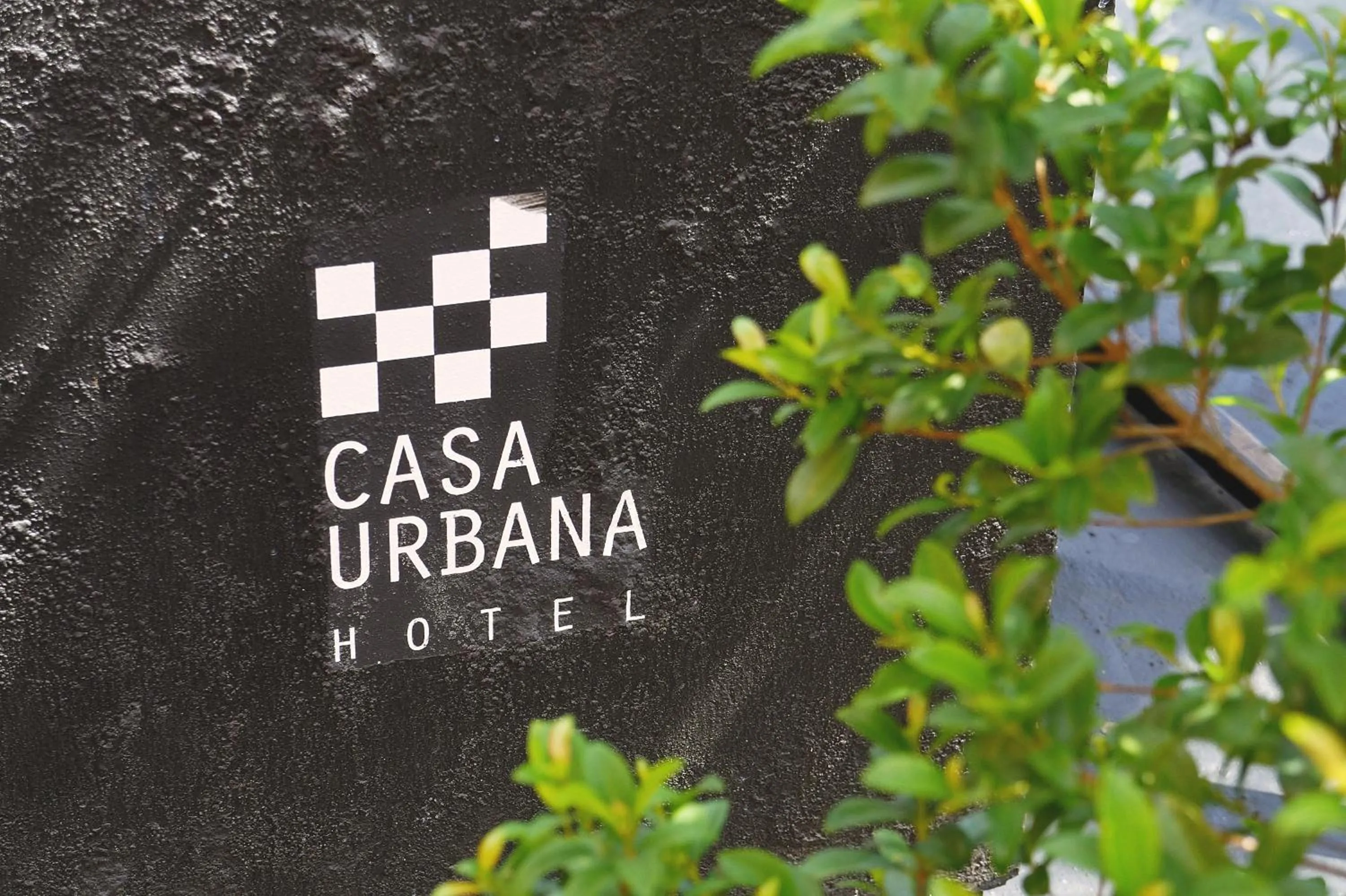 Property logo or sign in Casa Urbana Hotel