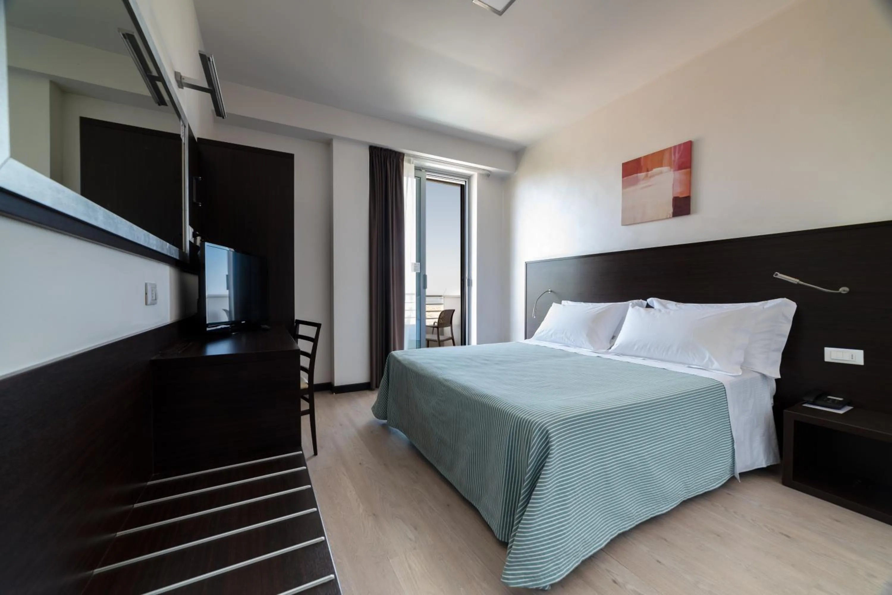 Bed in Alisei Palace Hotel