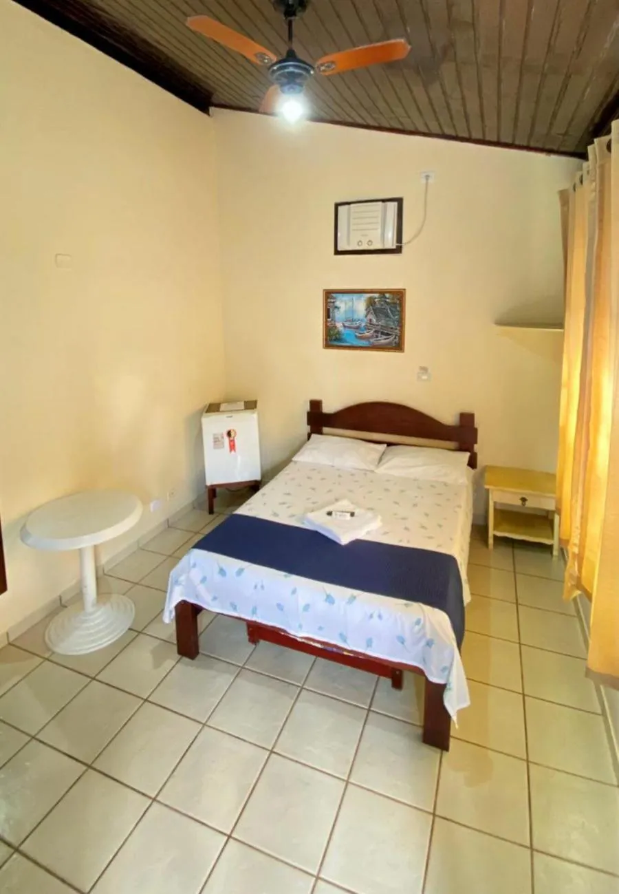 Bed in Pousada do Marcão