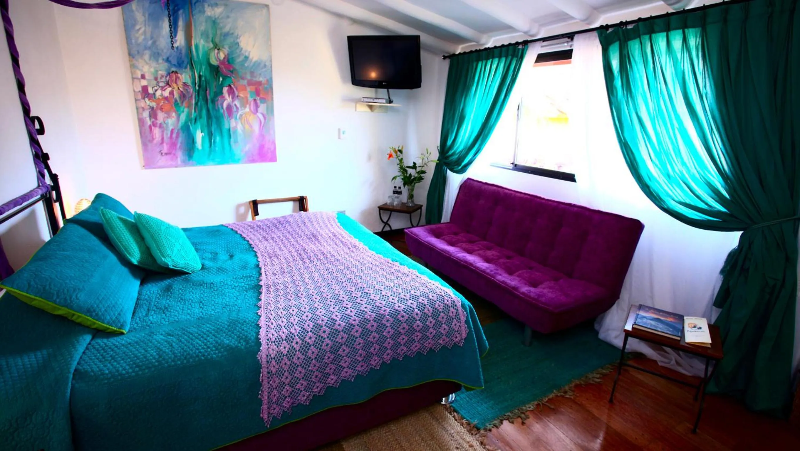 Bedroom, TV/Entertainment Center in Andean Wings Boutique Hotel