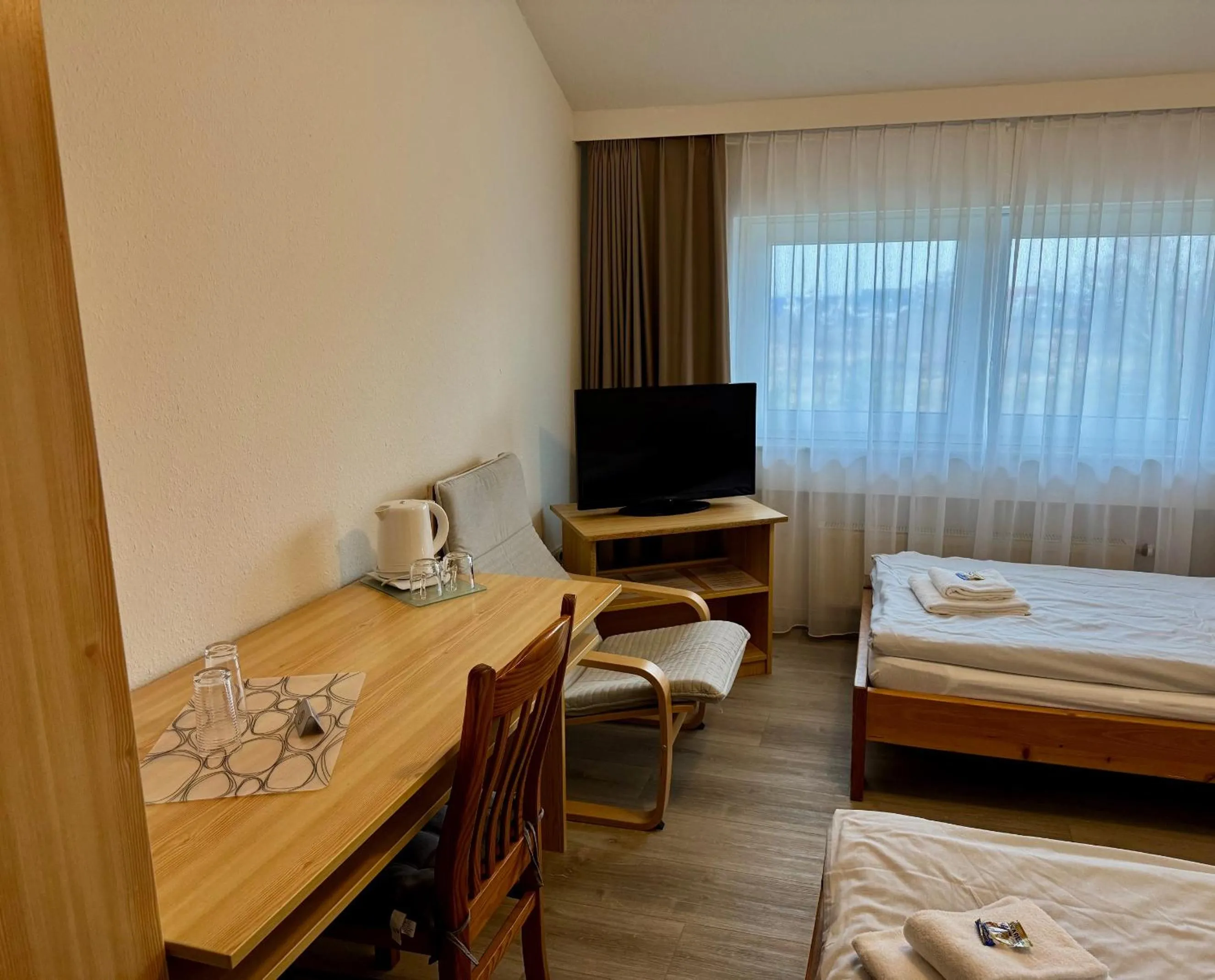 Photo of the whole room, Bed in Gästehaus Haßloch/Pfalz