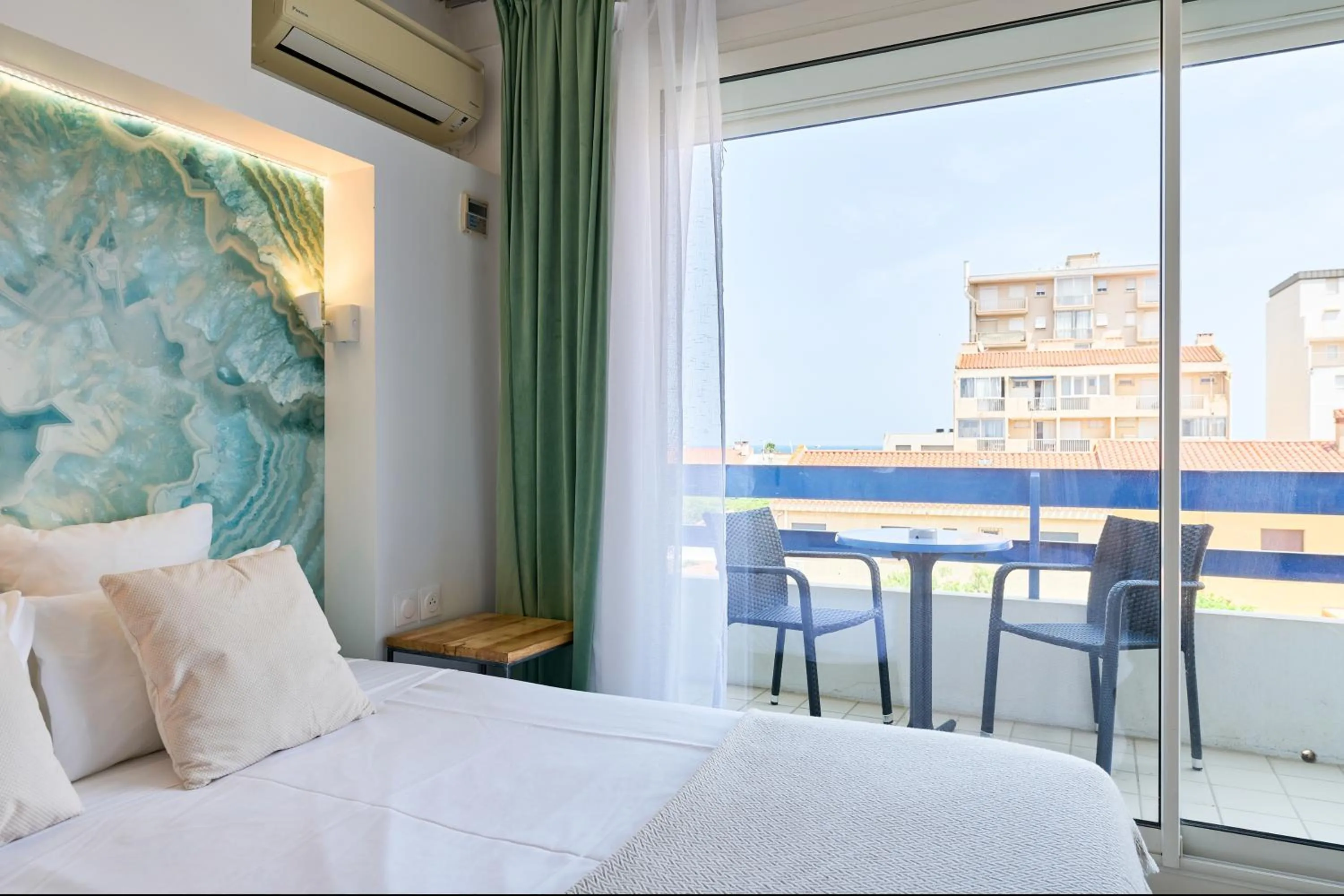 View (from property/room), Bed in Hôtel Les Sables - Urban Style - by Logis Hotels