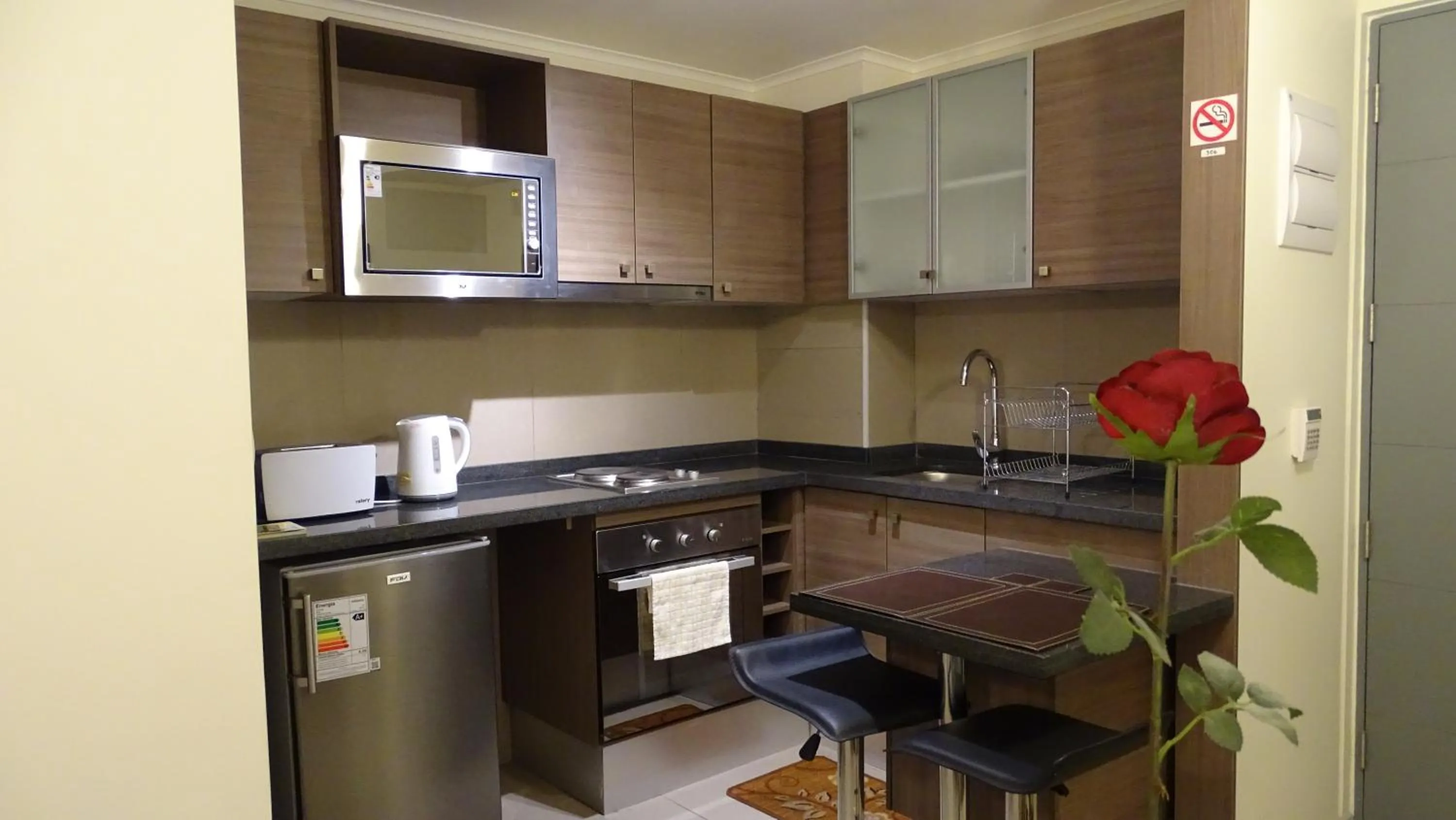 Kitchen or kitchenette in Moneda Express Apart