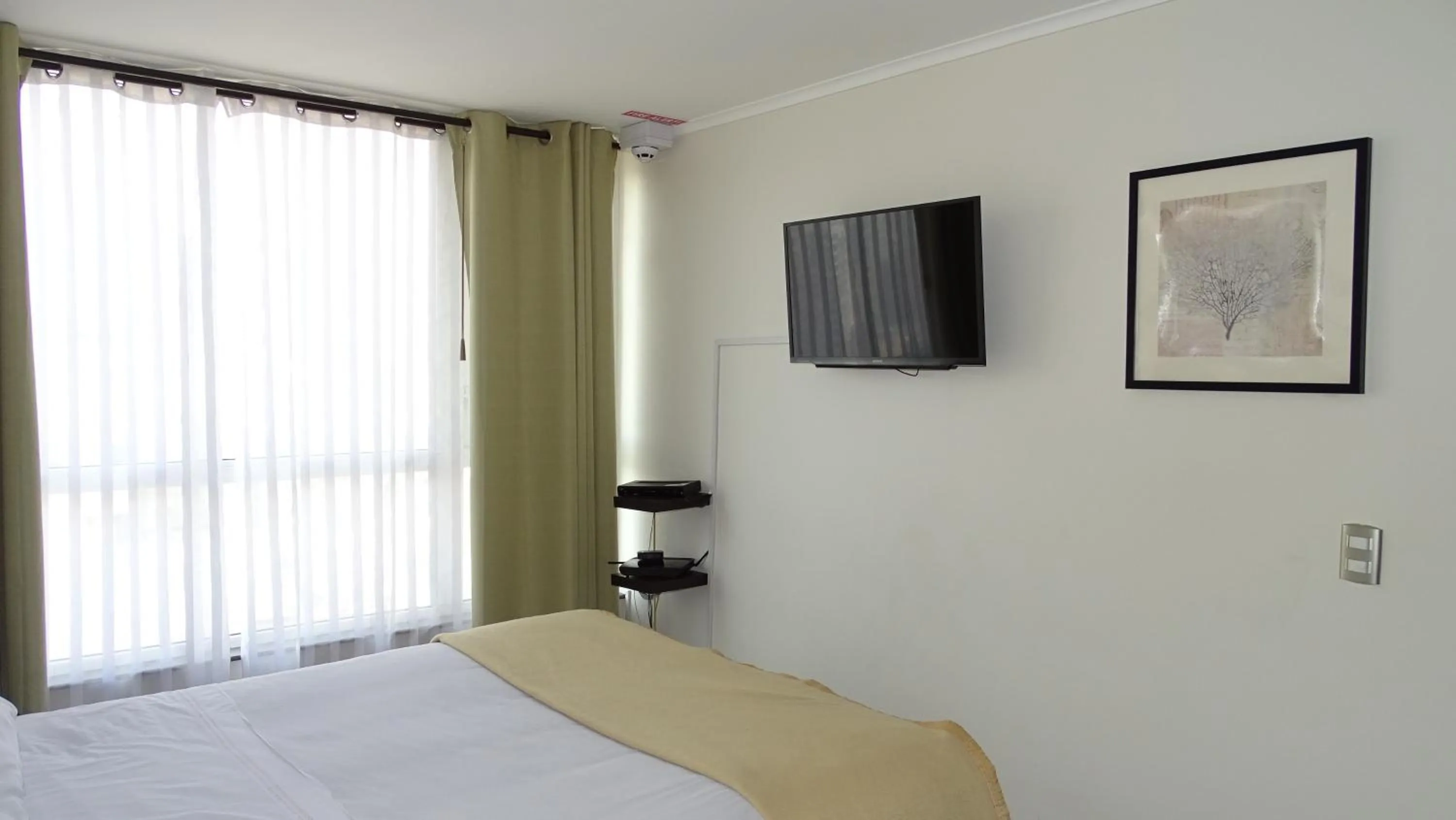 Bed in Moneda Express Apart