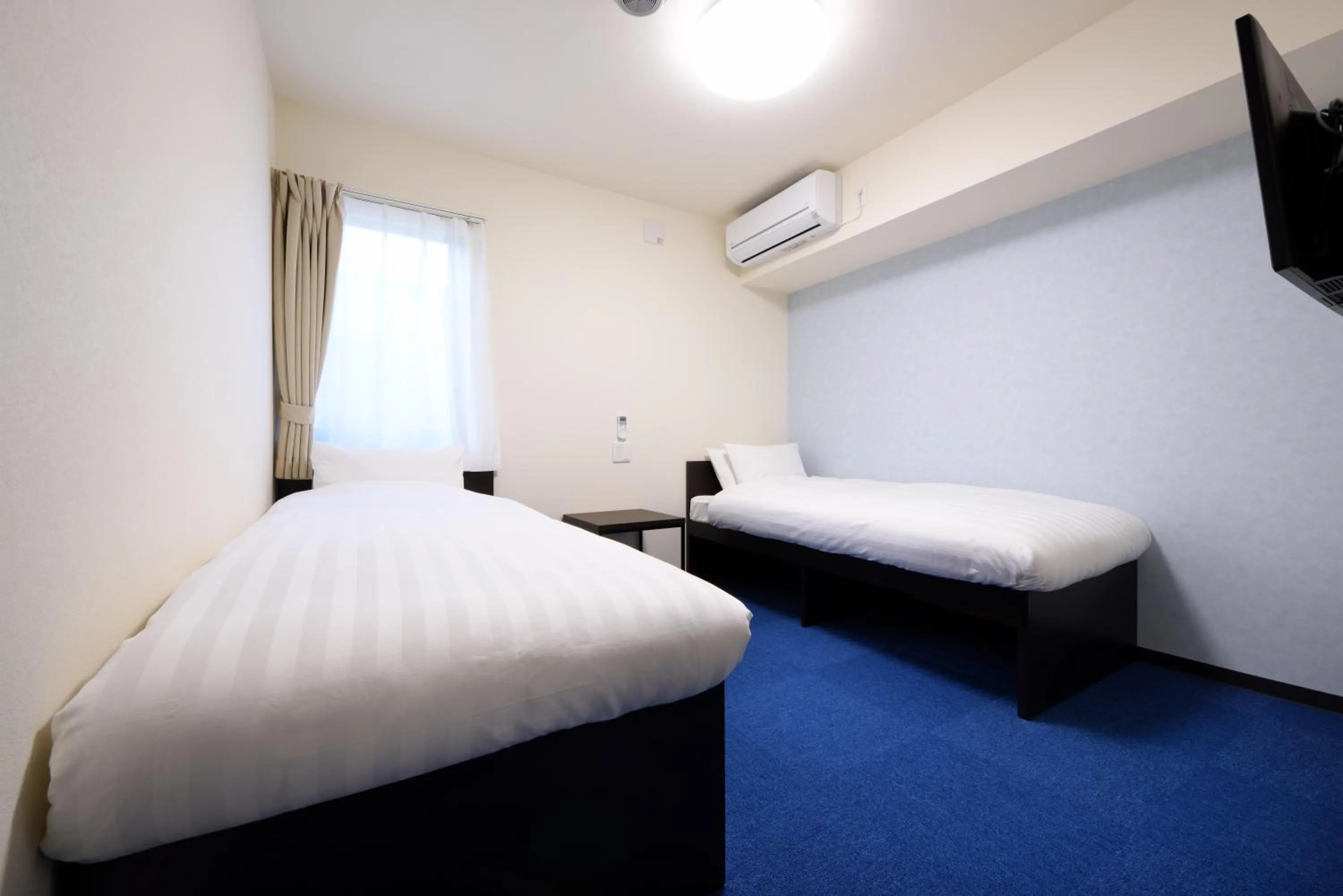 Bed in La'gent Inn Kesennuma