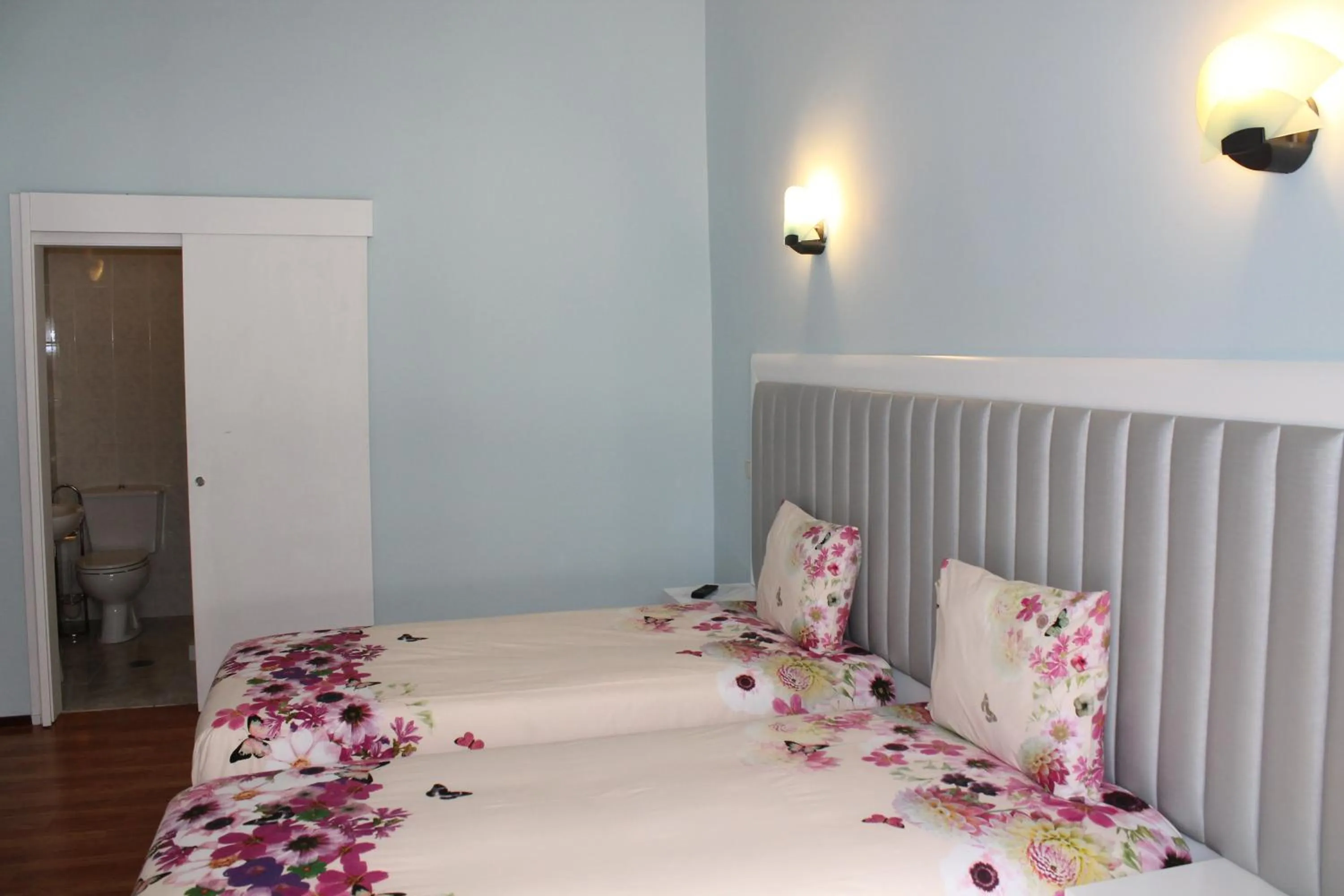 Bedroom, Bed in Grande Oceano Guest House