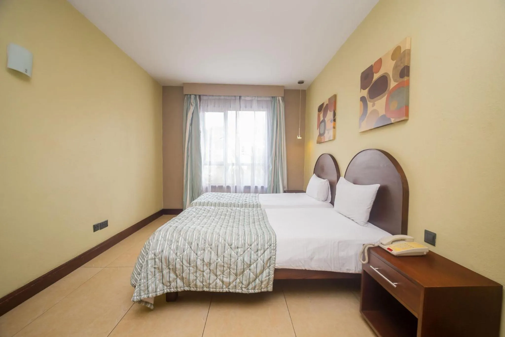 Photo of the whole room, Bed in Taarifa Suites by Dunhill Serviced Apartments