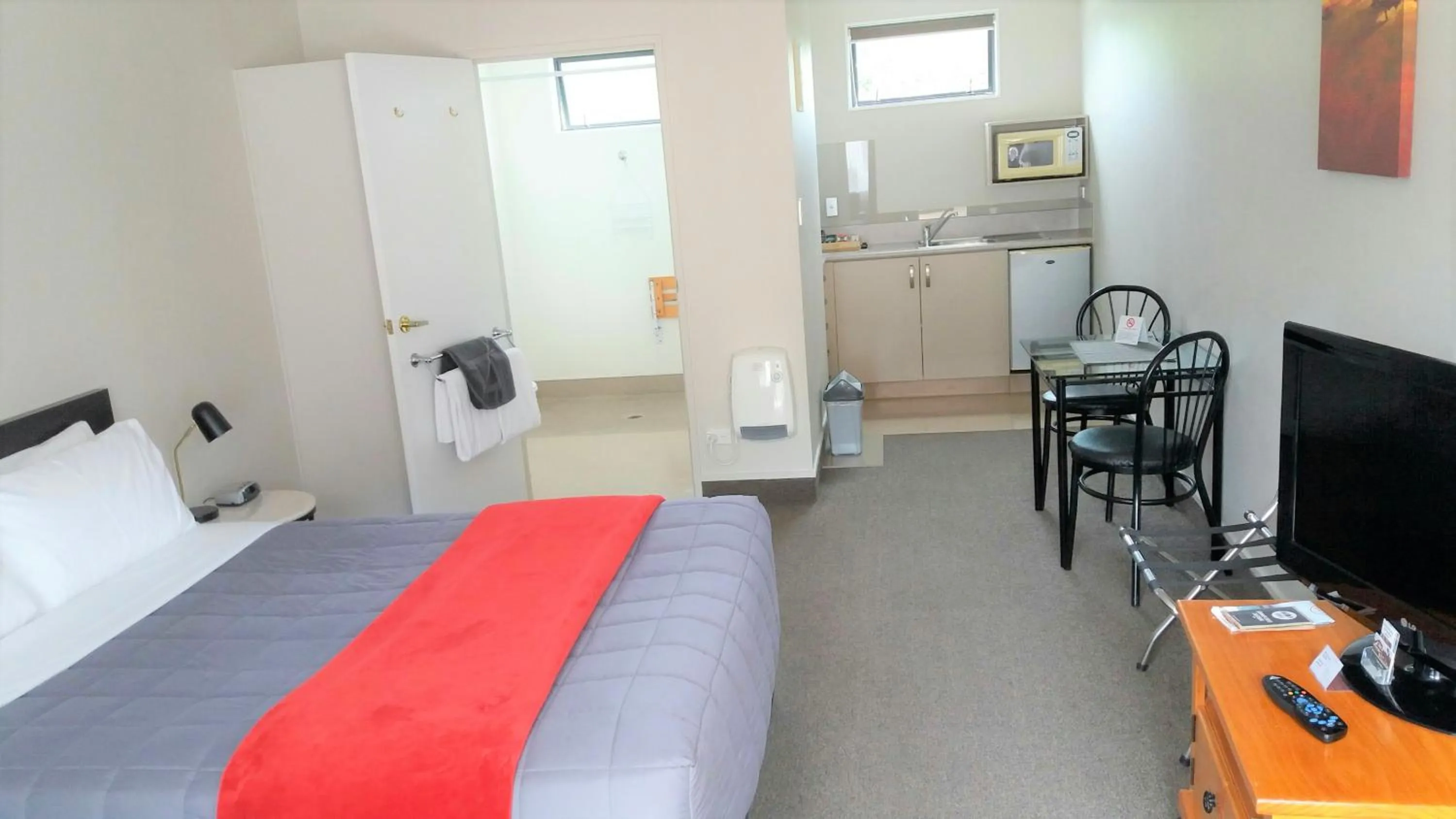 Bed in Bay Palm Motel