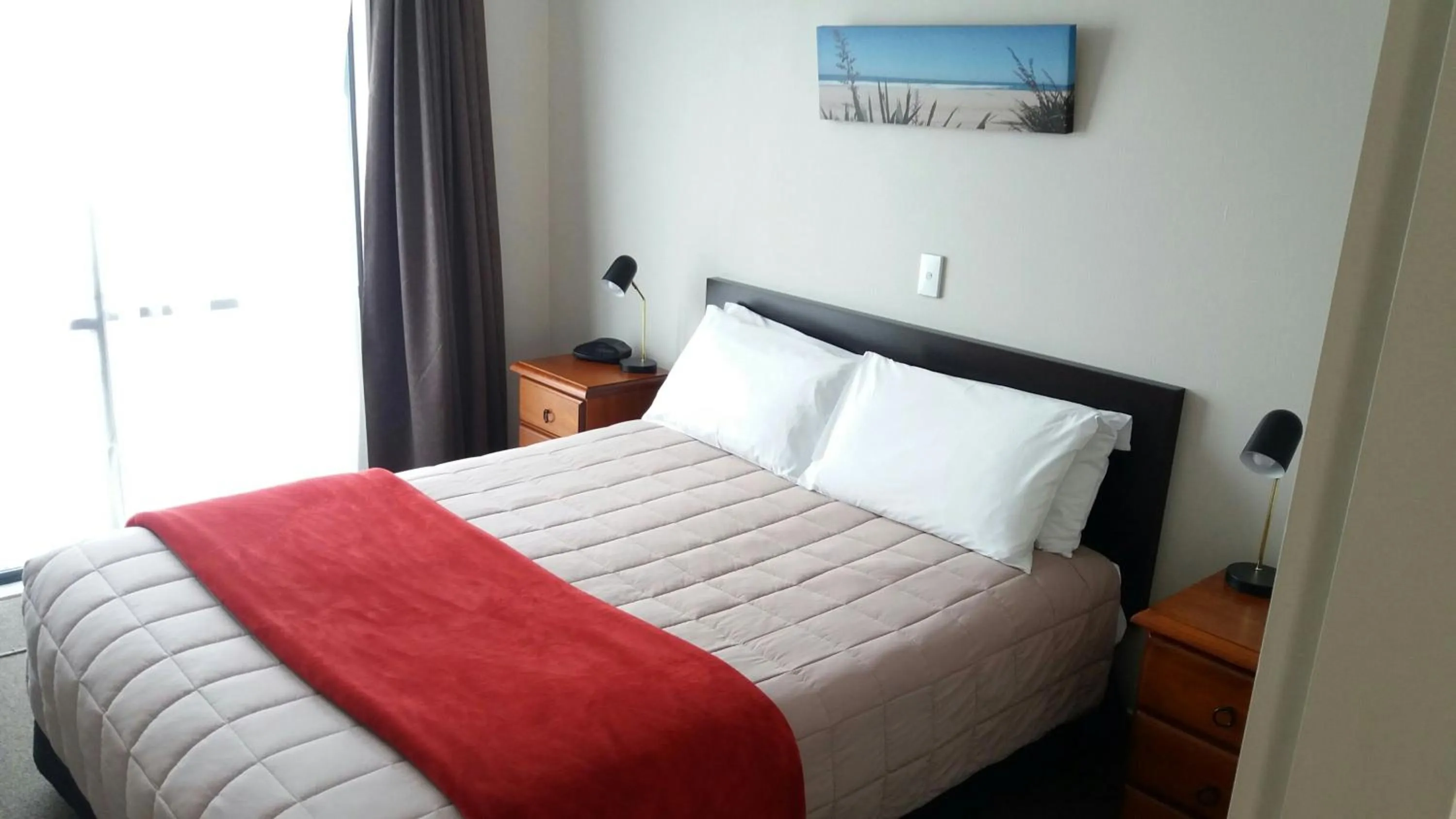 Bed in Bay Palm Motel