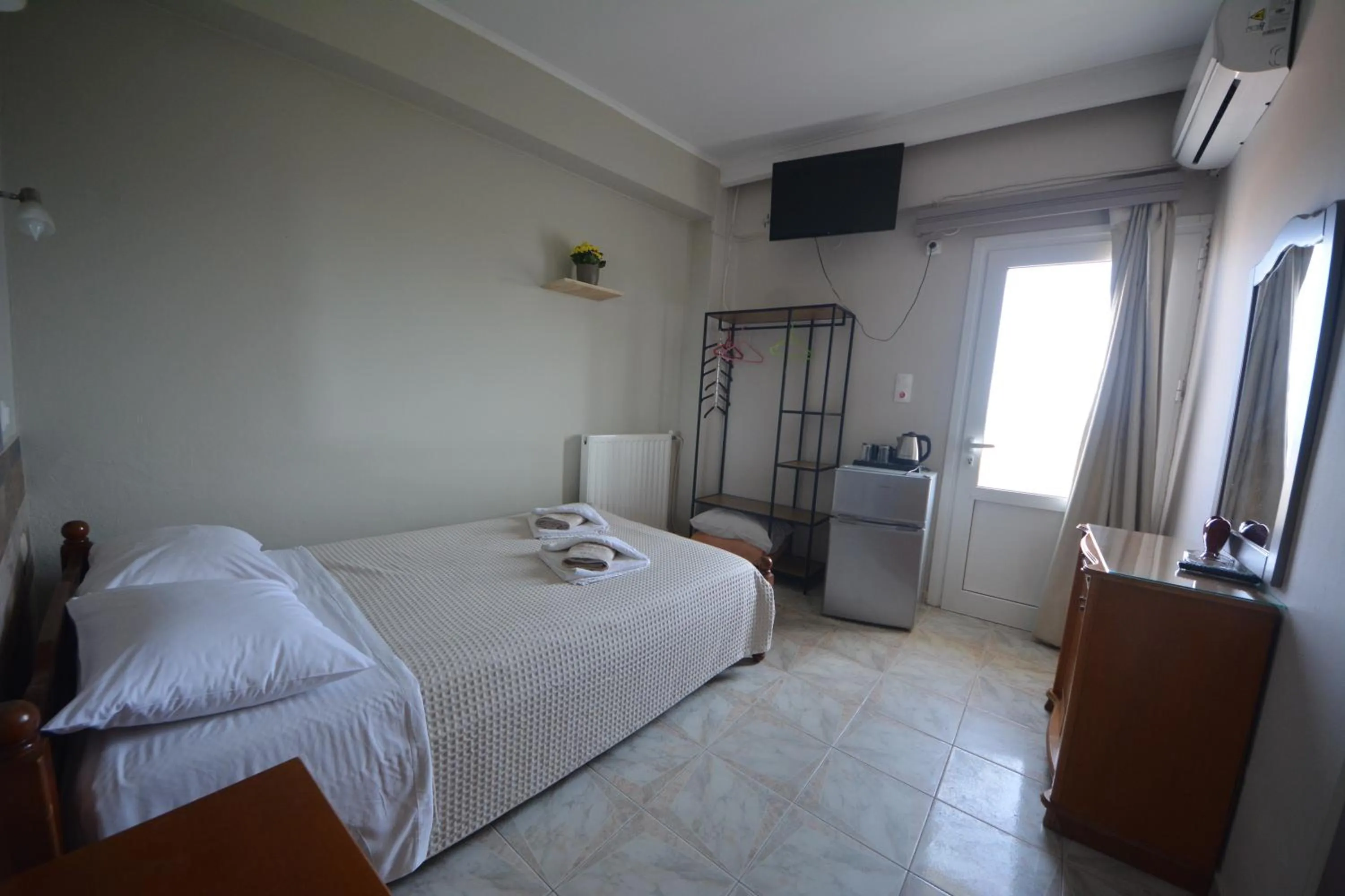 Bed in Bikakis Family Apartments