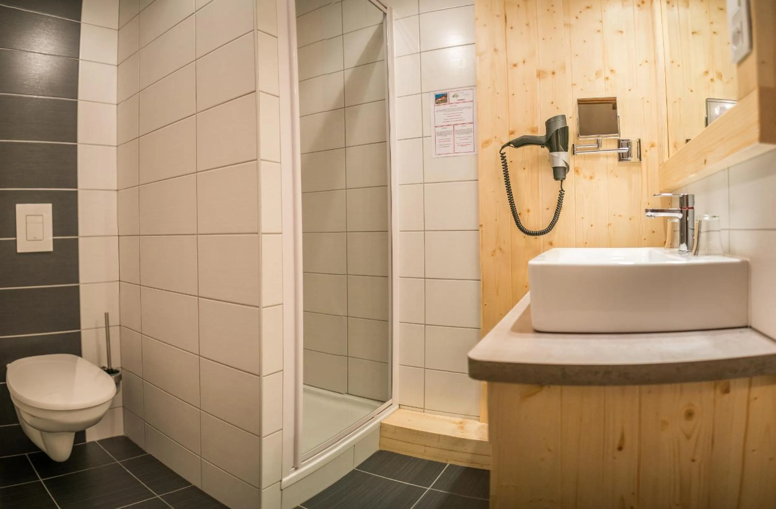 Bathroom in Logis Hôtel Le Vétiné