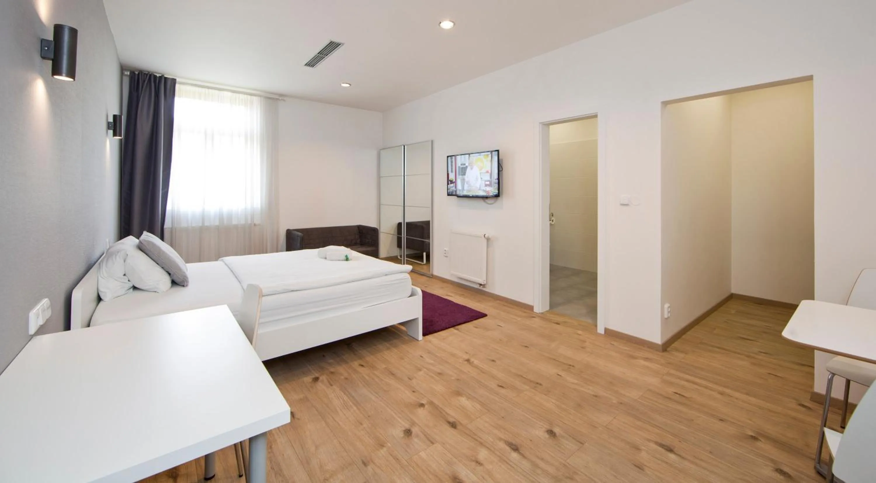 Bed in Rozmaryn Rooms & Apartments