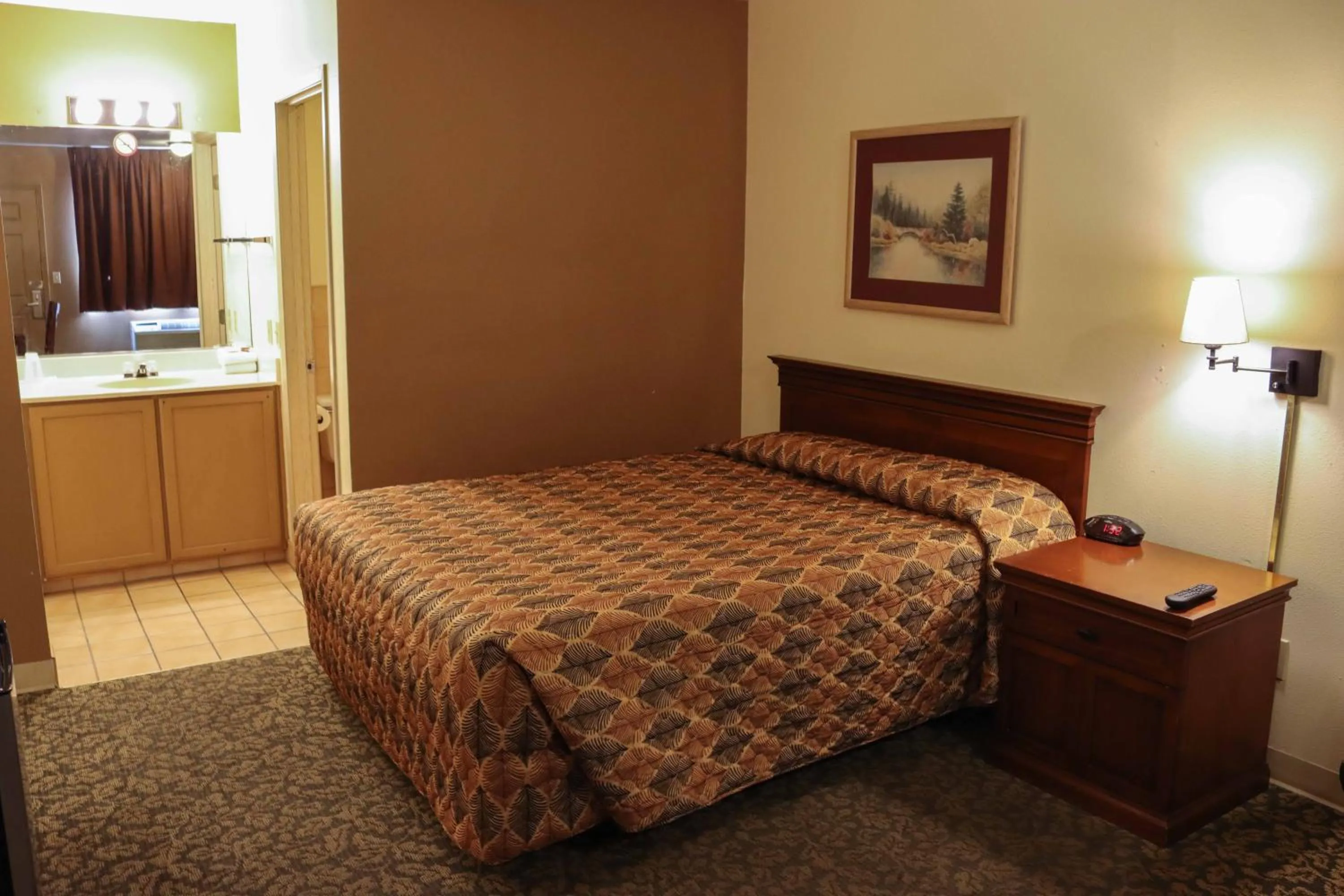 Bed in Tiki Lodge Motel