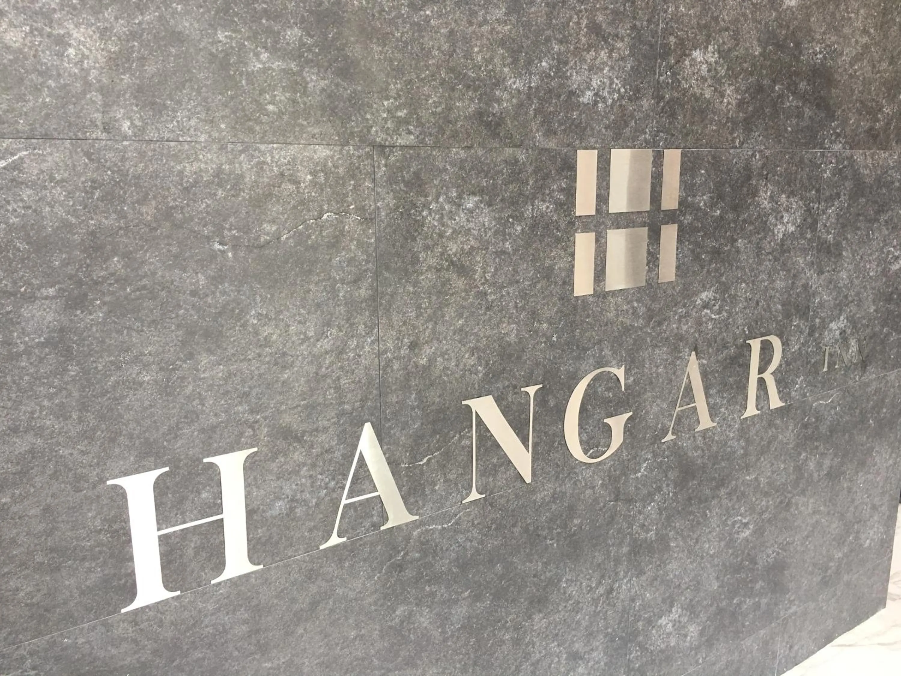 Property logo or sign in Hangar Inn Guadalajara Aeropuerto