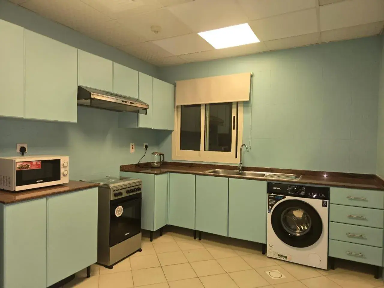 Kitchen or kitchenette in Al Raya Hotel Apartments Kitchen or kitchenette in Al Raya Hotel Apartments