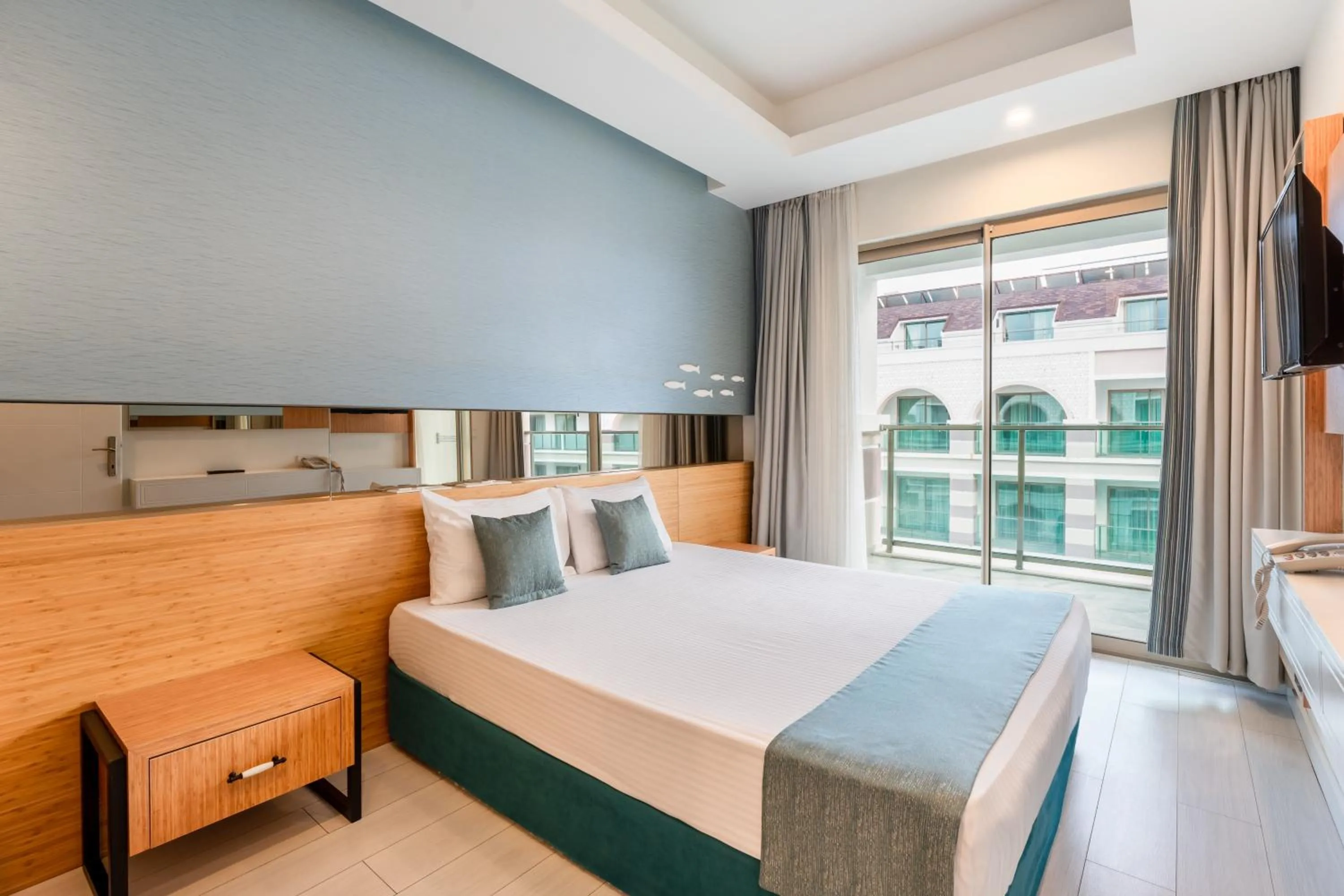 Bed in Dosinia Luxury Resort-Ultra All Inclusive