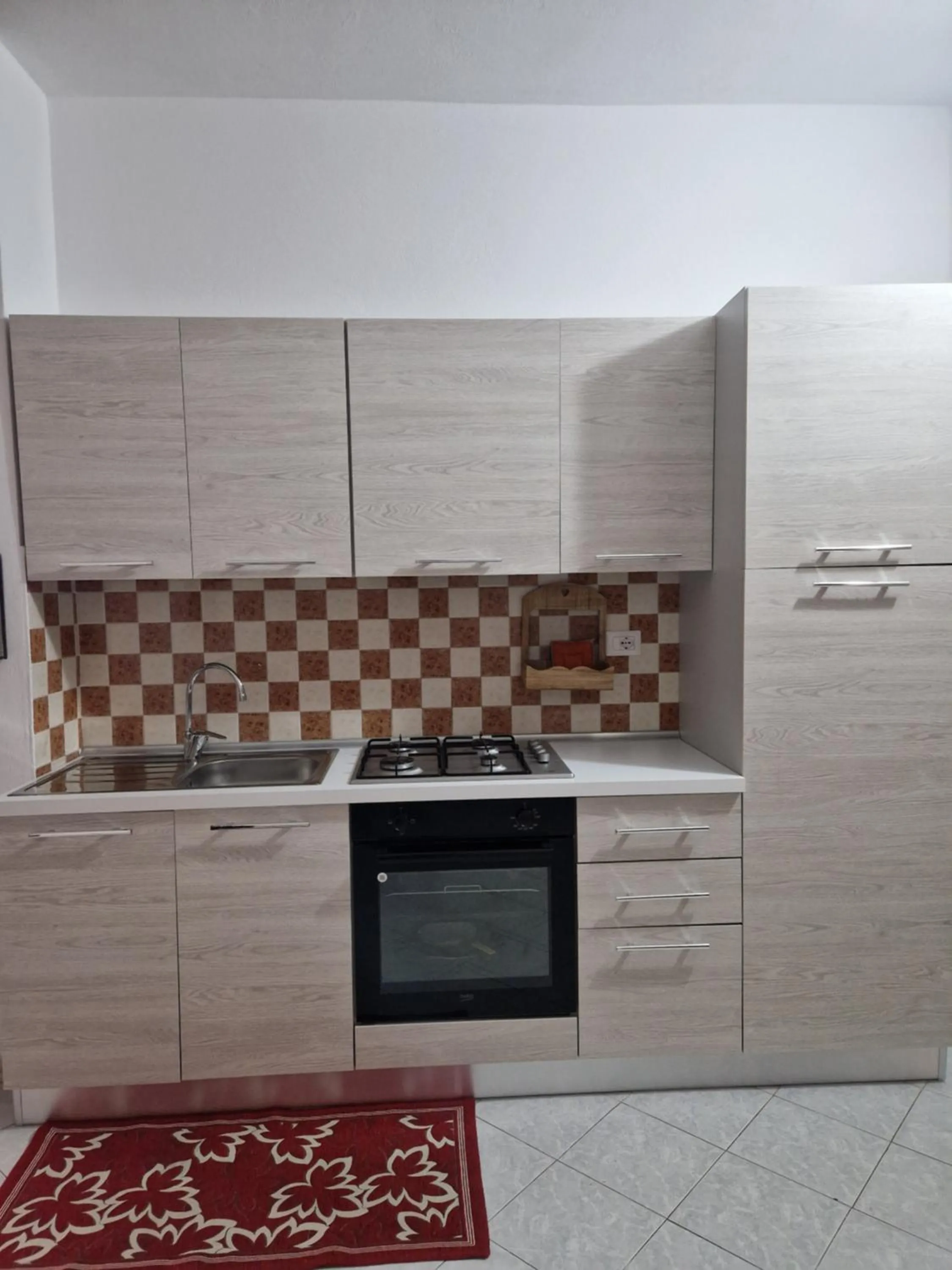 Kitchen or kitchenette in SANTA VENERE Apartments "PARCHEGGIO interno MOTO-AUTO" Ricarica auto Elettriche