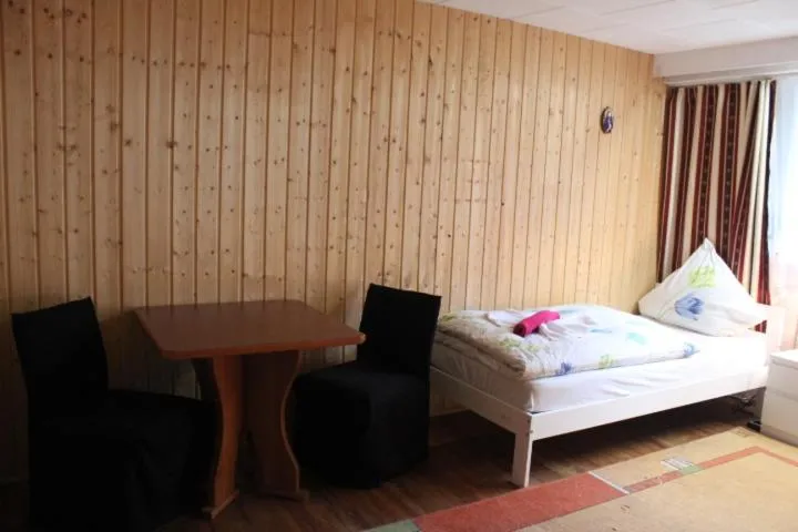 Seating area, Bed in Waldpension Pfeiferhaus
