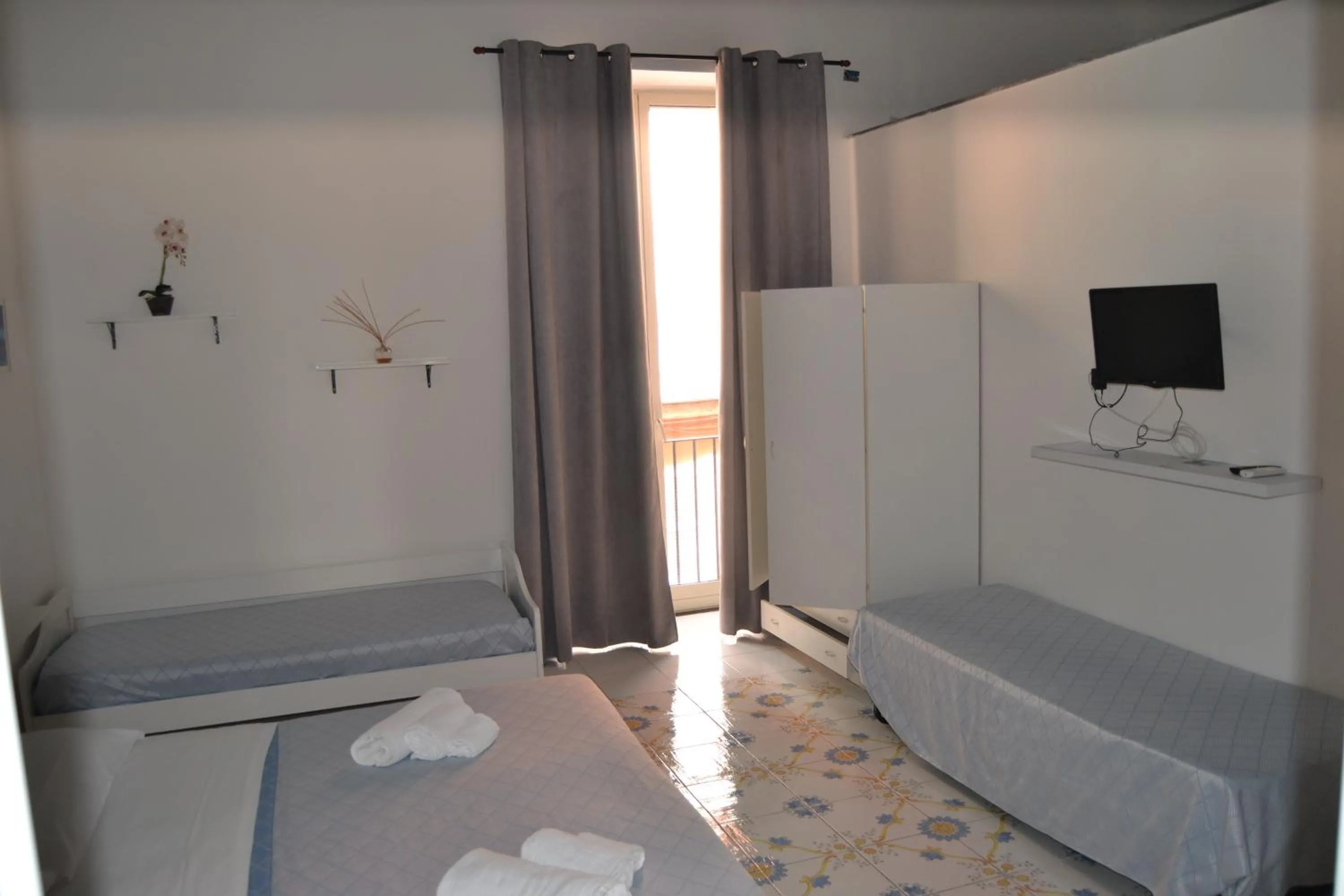 Bed in Il Borghetto Apartments & Rooms