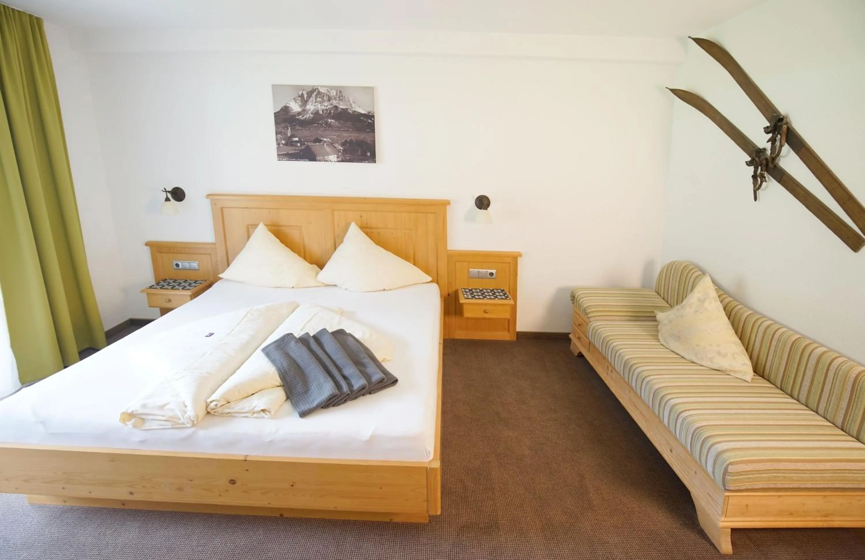 Bedroom, Bed in Alpenstern rooms & suites