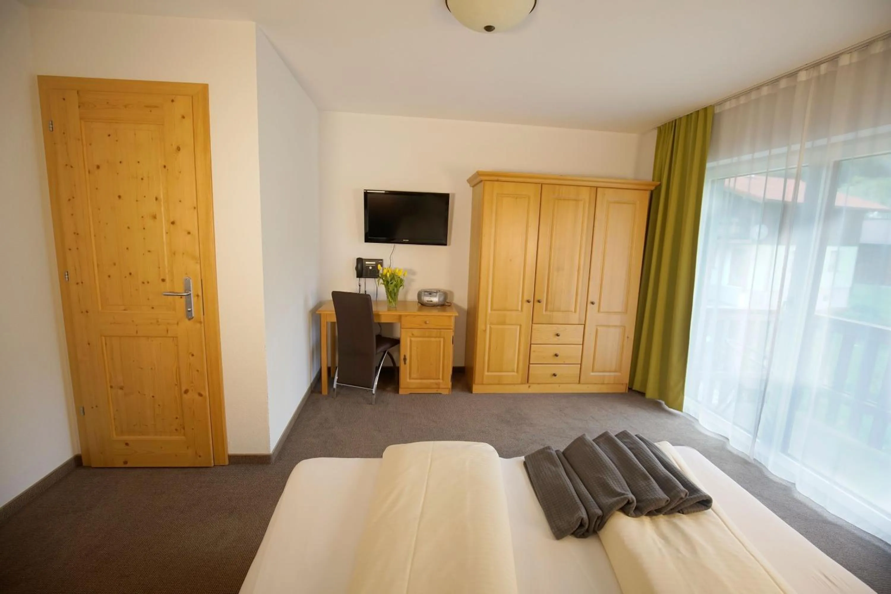 Bedroom, Bed in Alpenstern rooms & suites