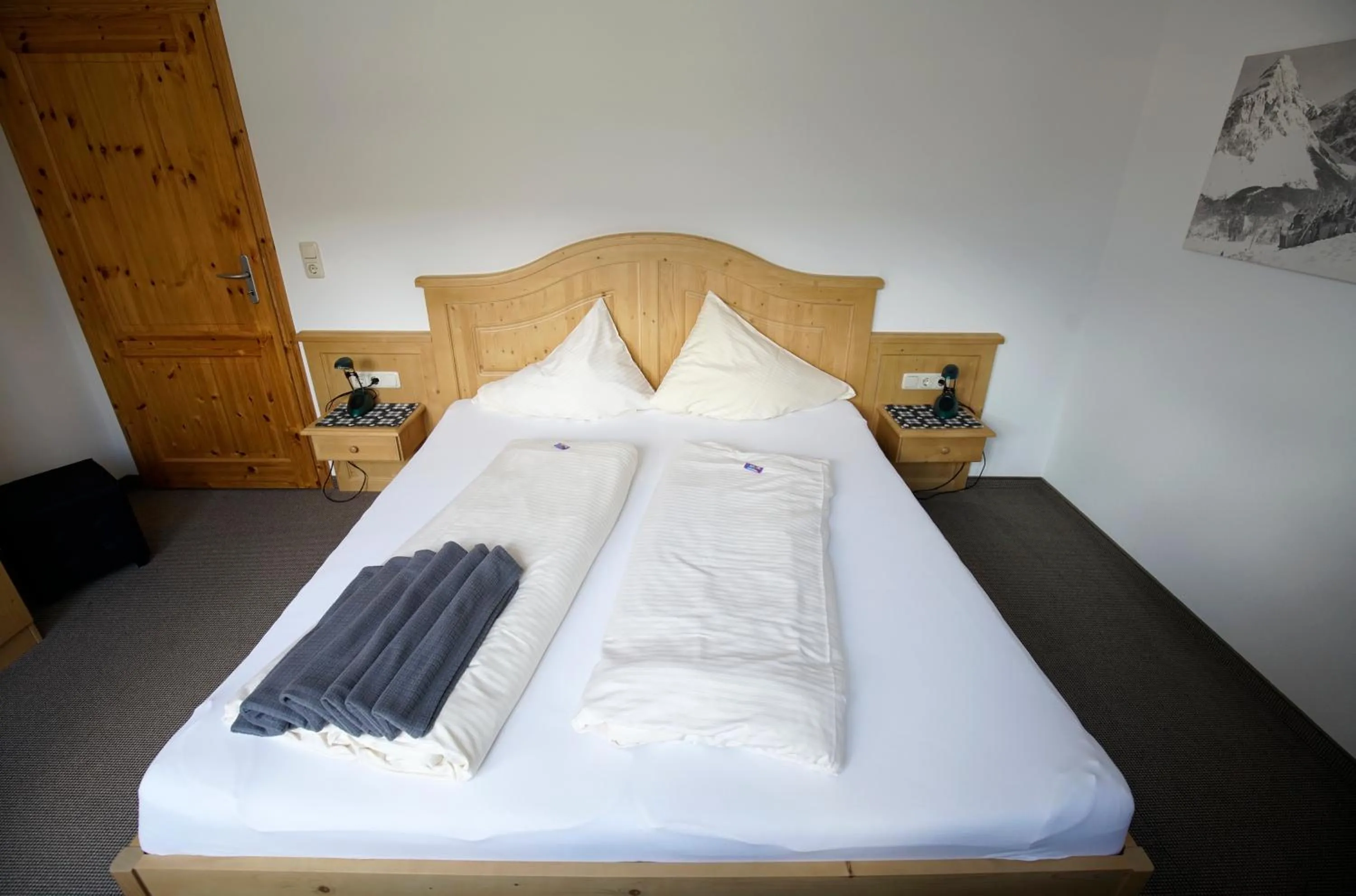Bed in Alpenstern rooms & suites