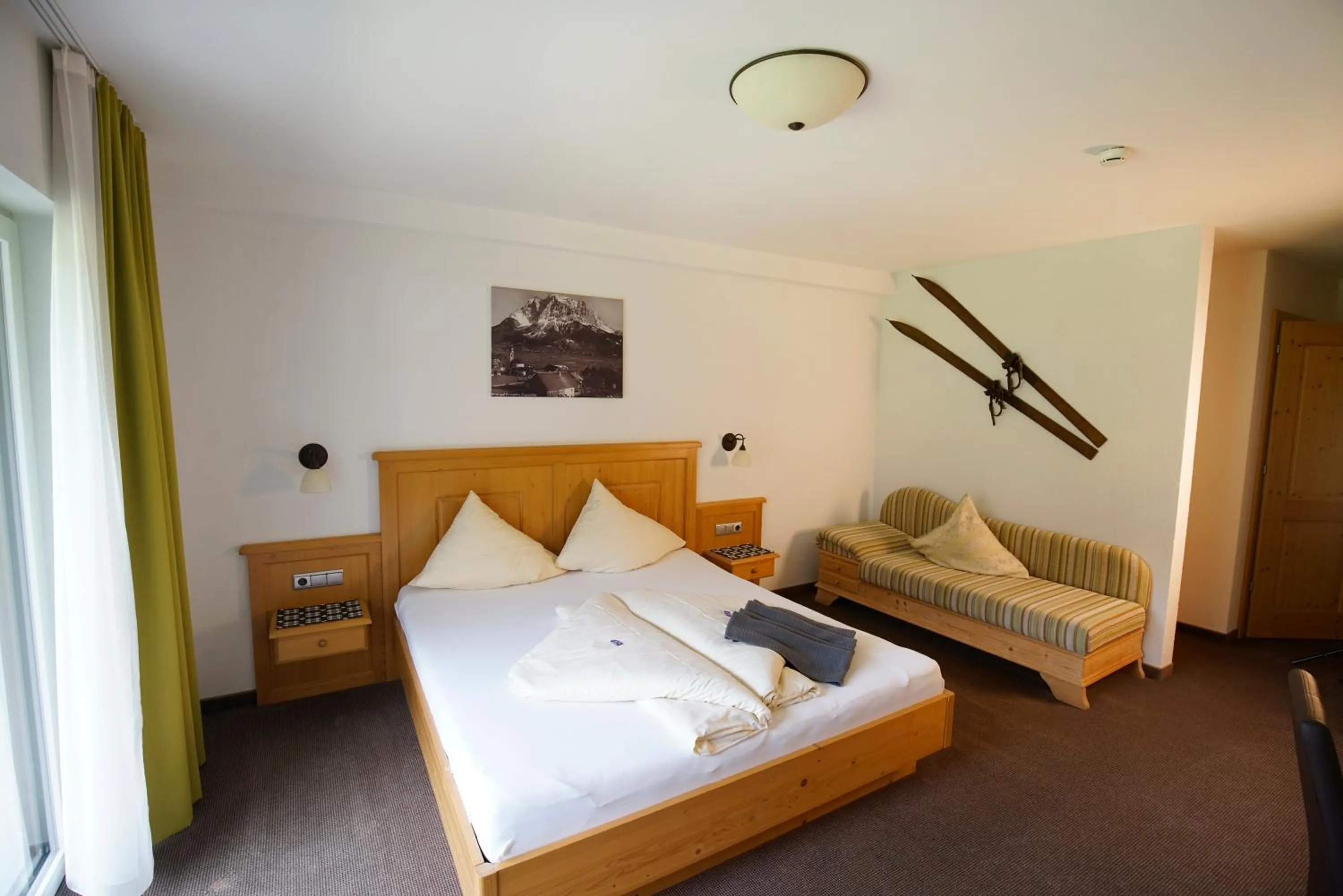 Bed in Alpenstern rooms & suites