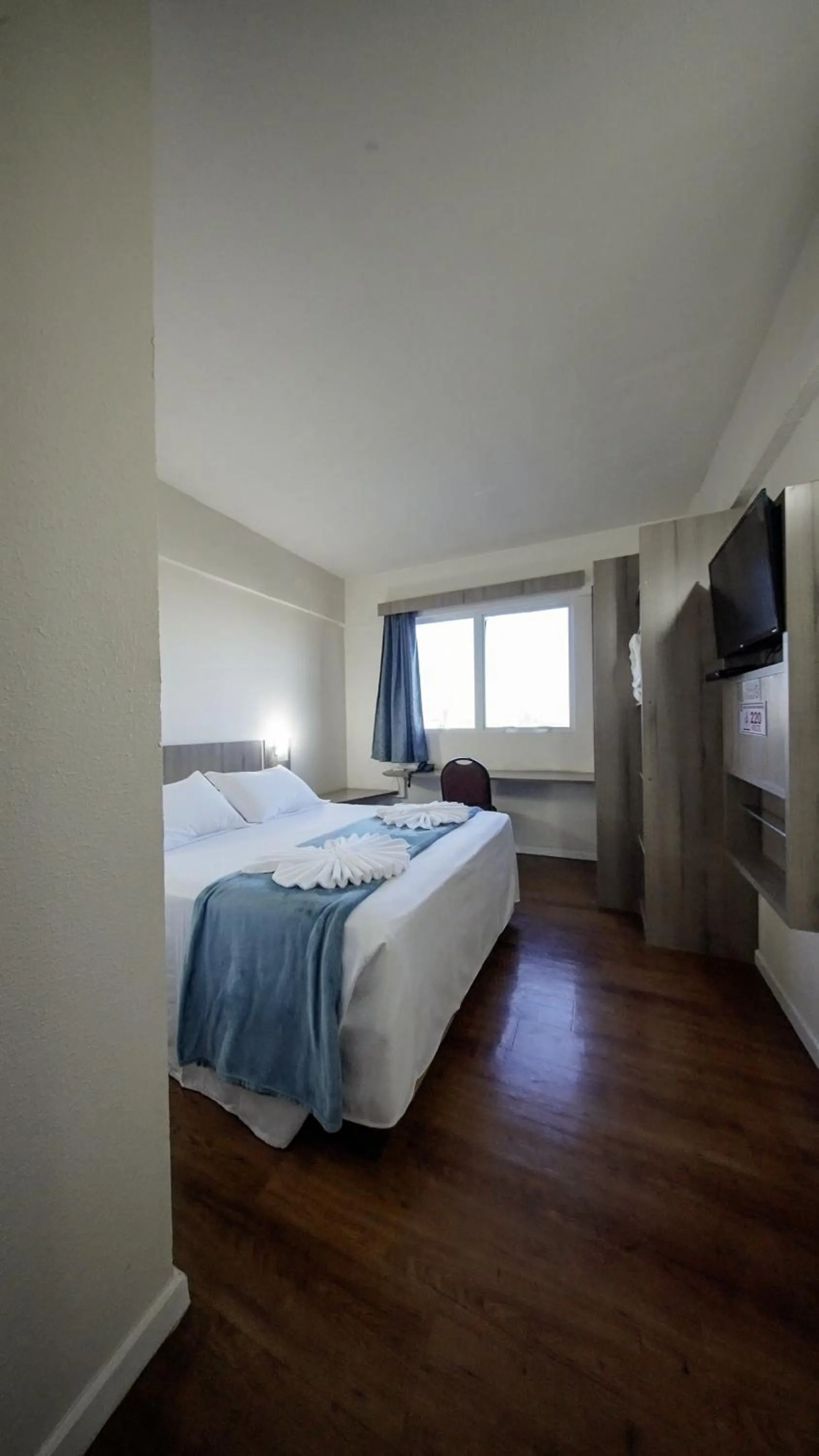 Bed in LH Plaza Hotel