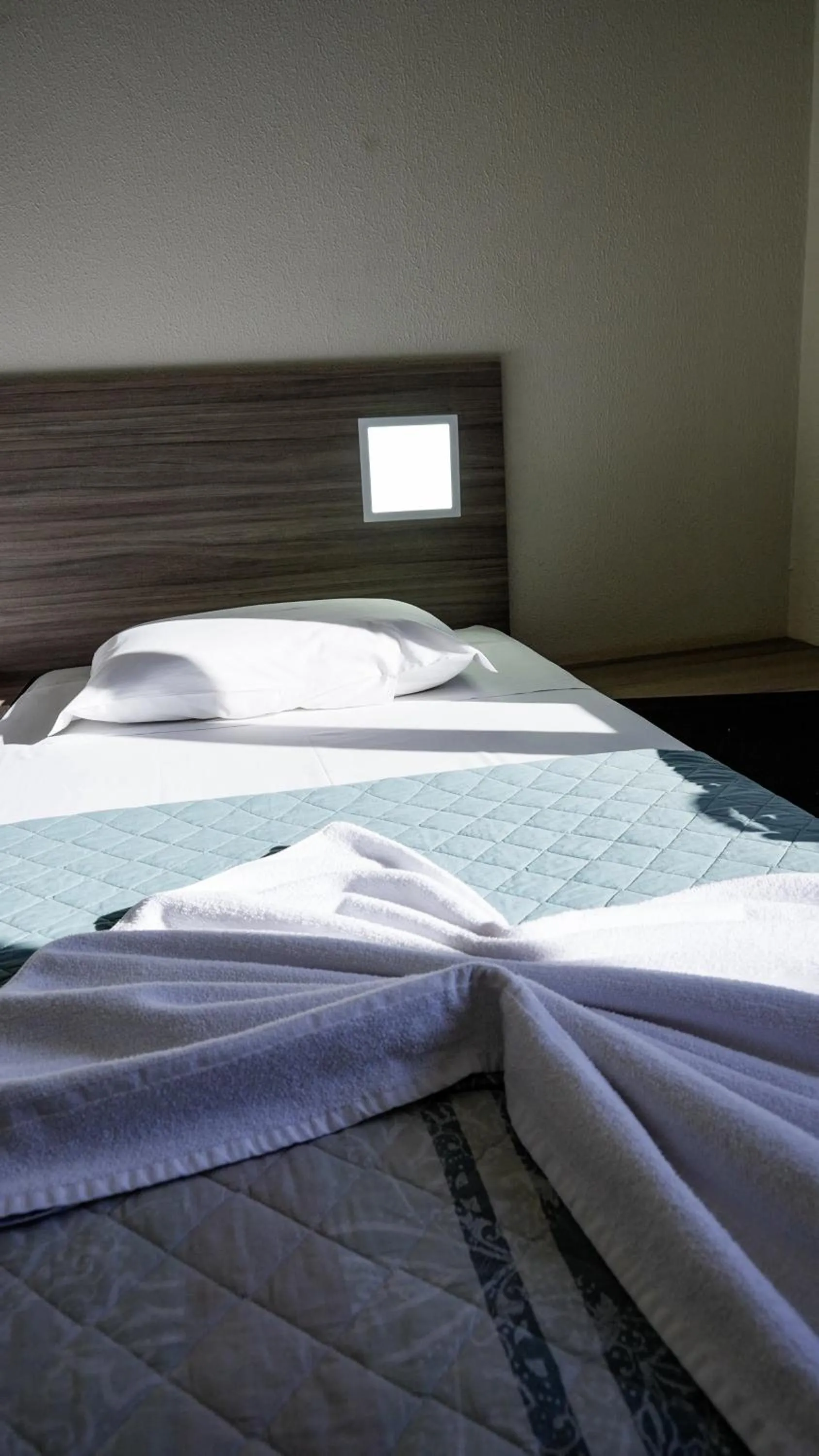 Bed in LH Plaza Hotel