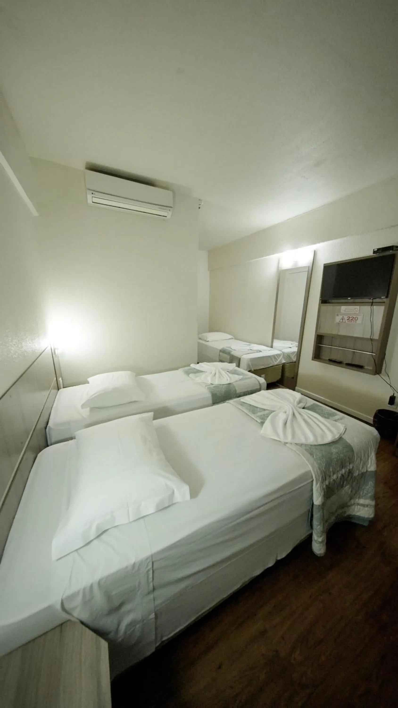 Bed in LH Plaza Hotel