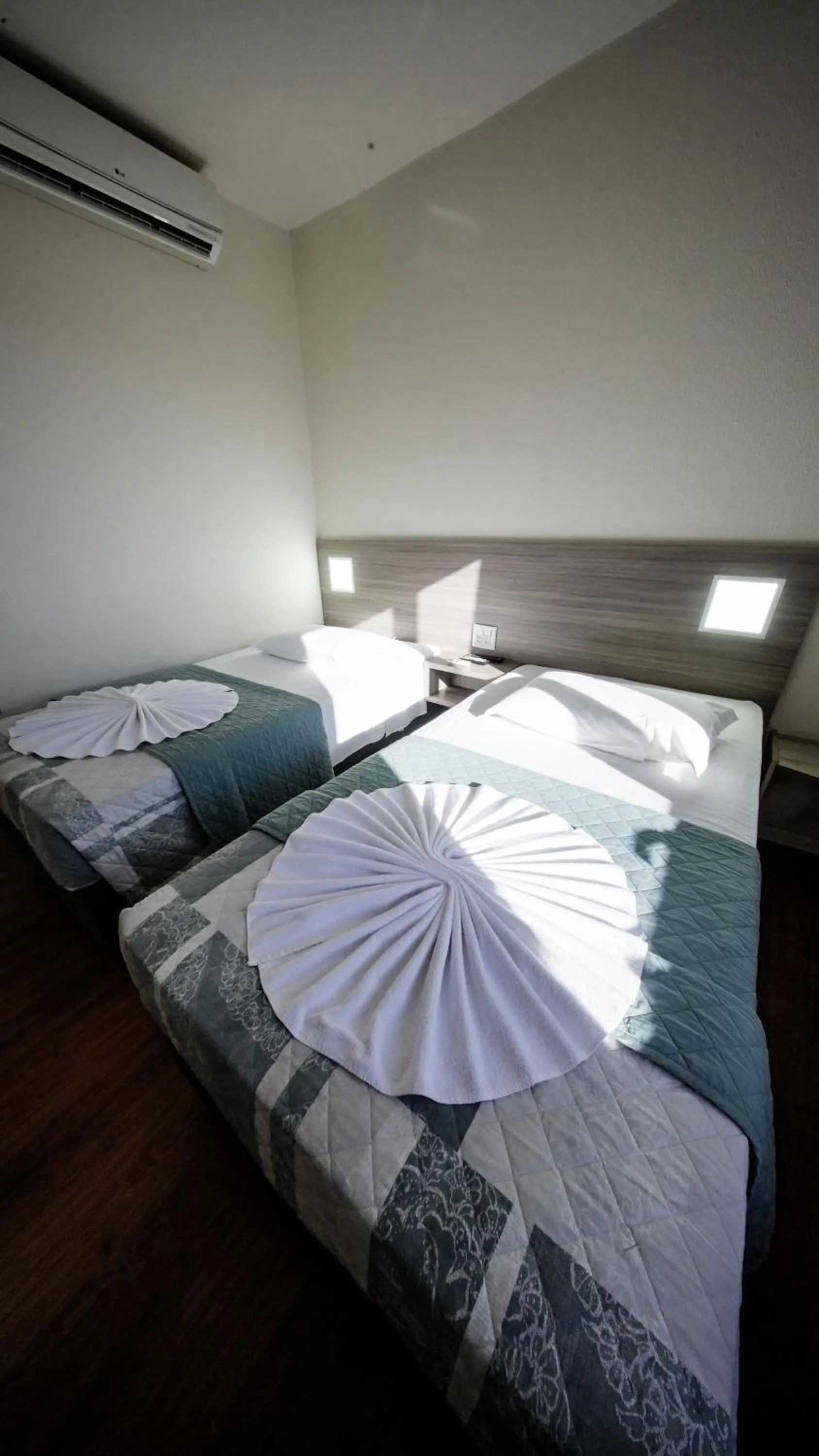 Bed in LH Plaza Hotel