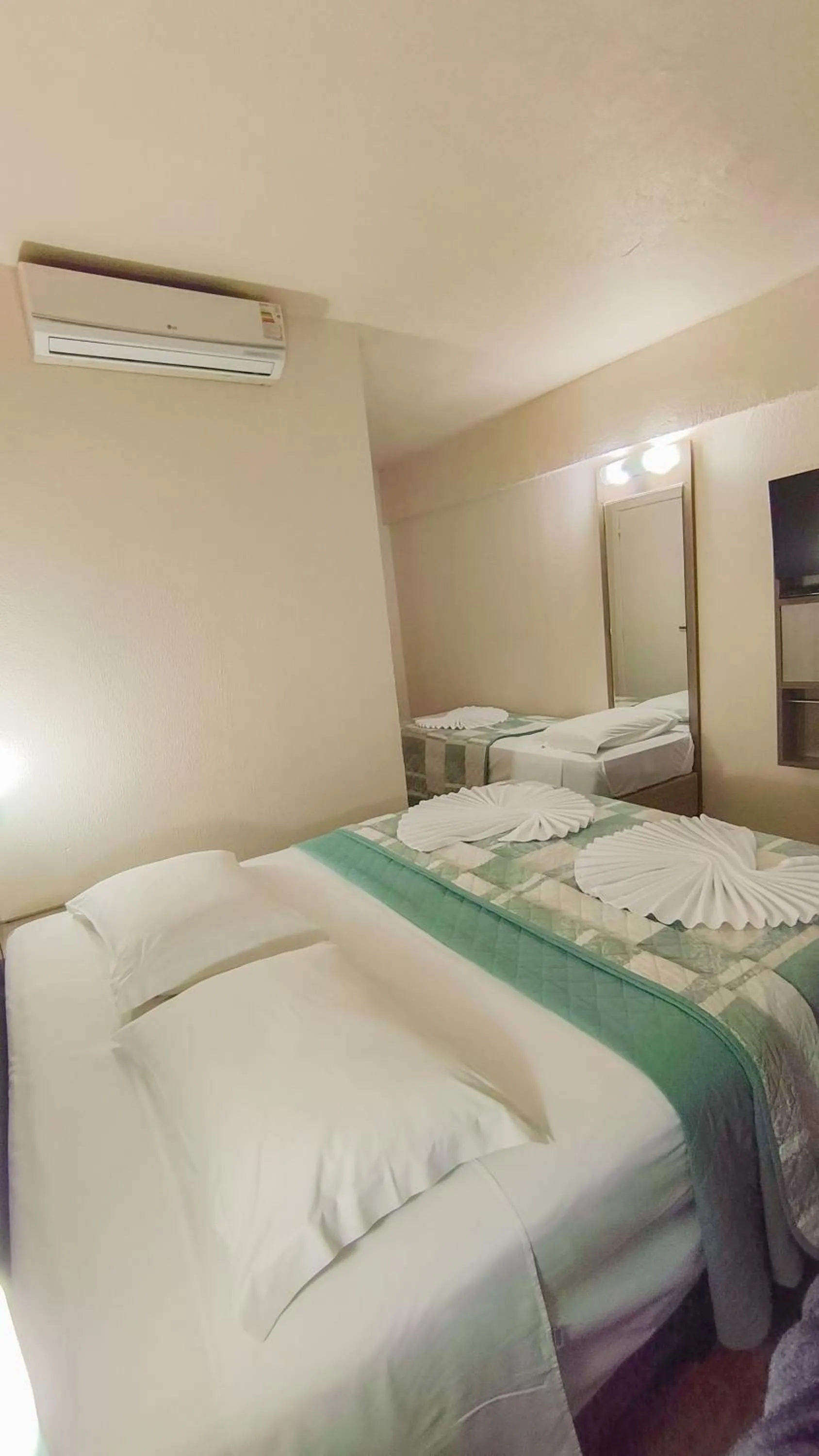 Bed in LH Plaza Hotel