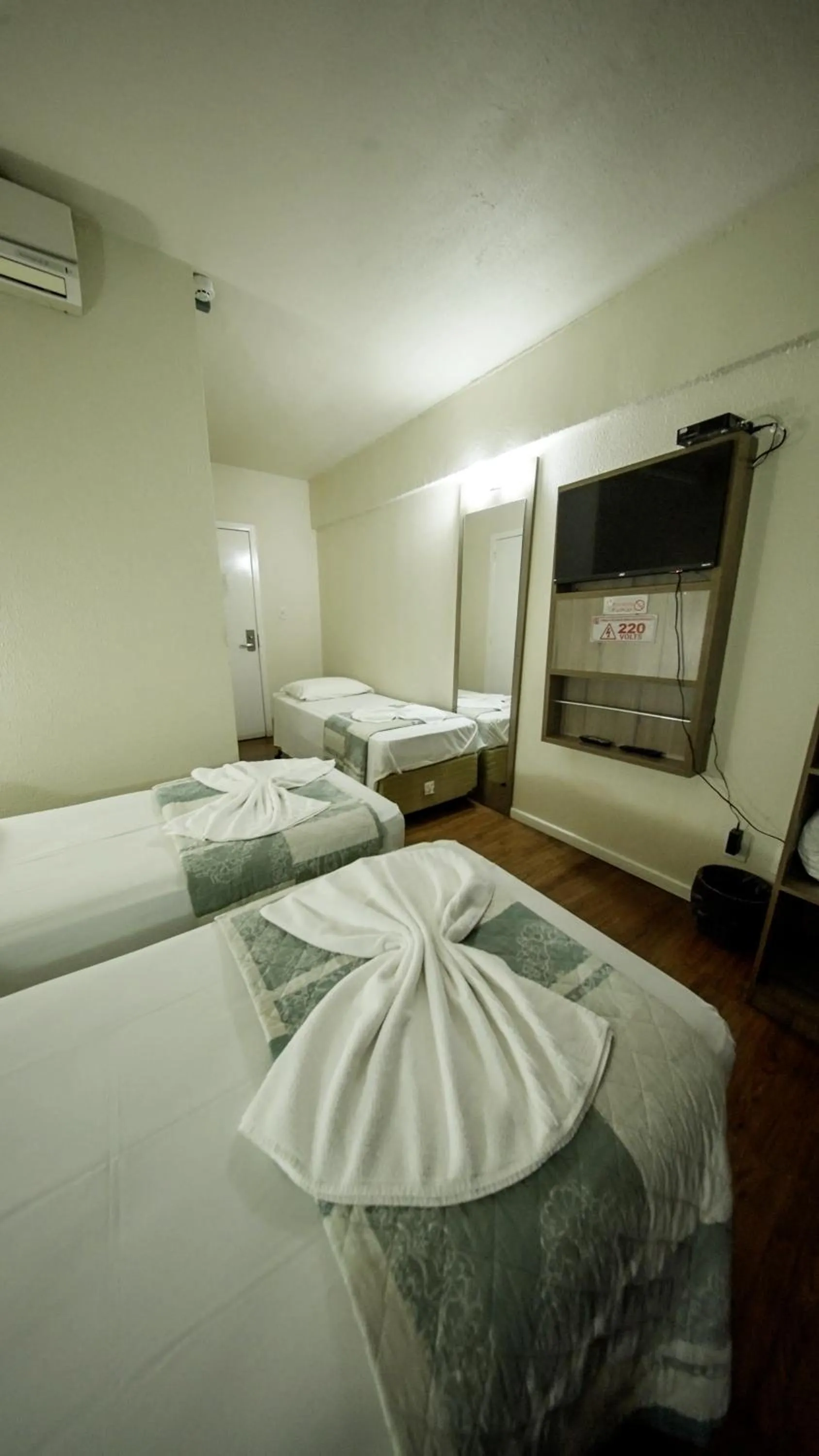 Bed in LH Plaza Hotel