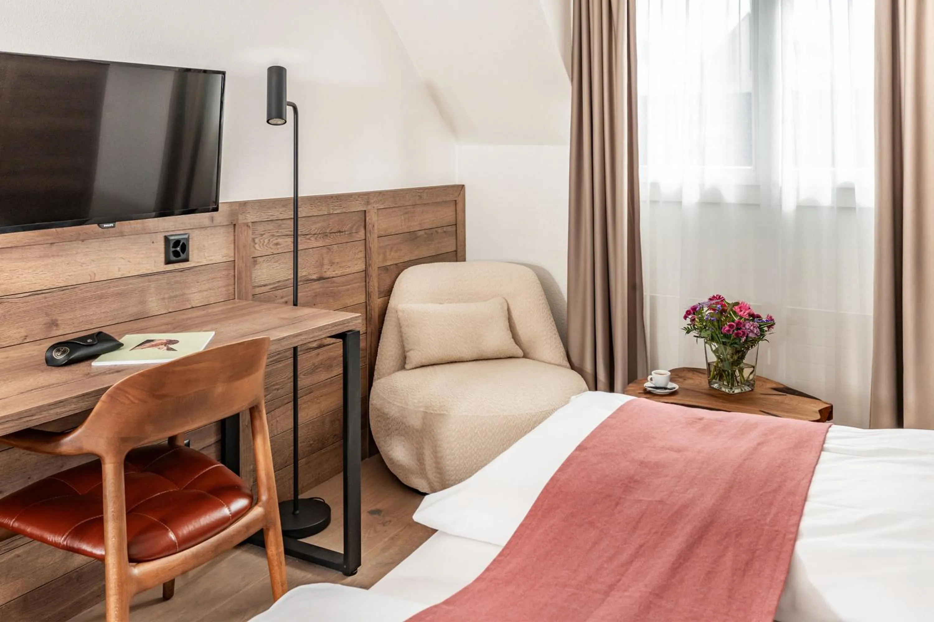 Bedroom, Bed in Tailormade Hotel KRONE Sarnen